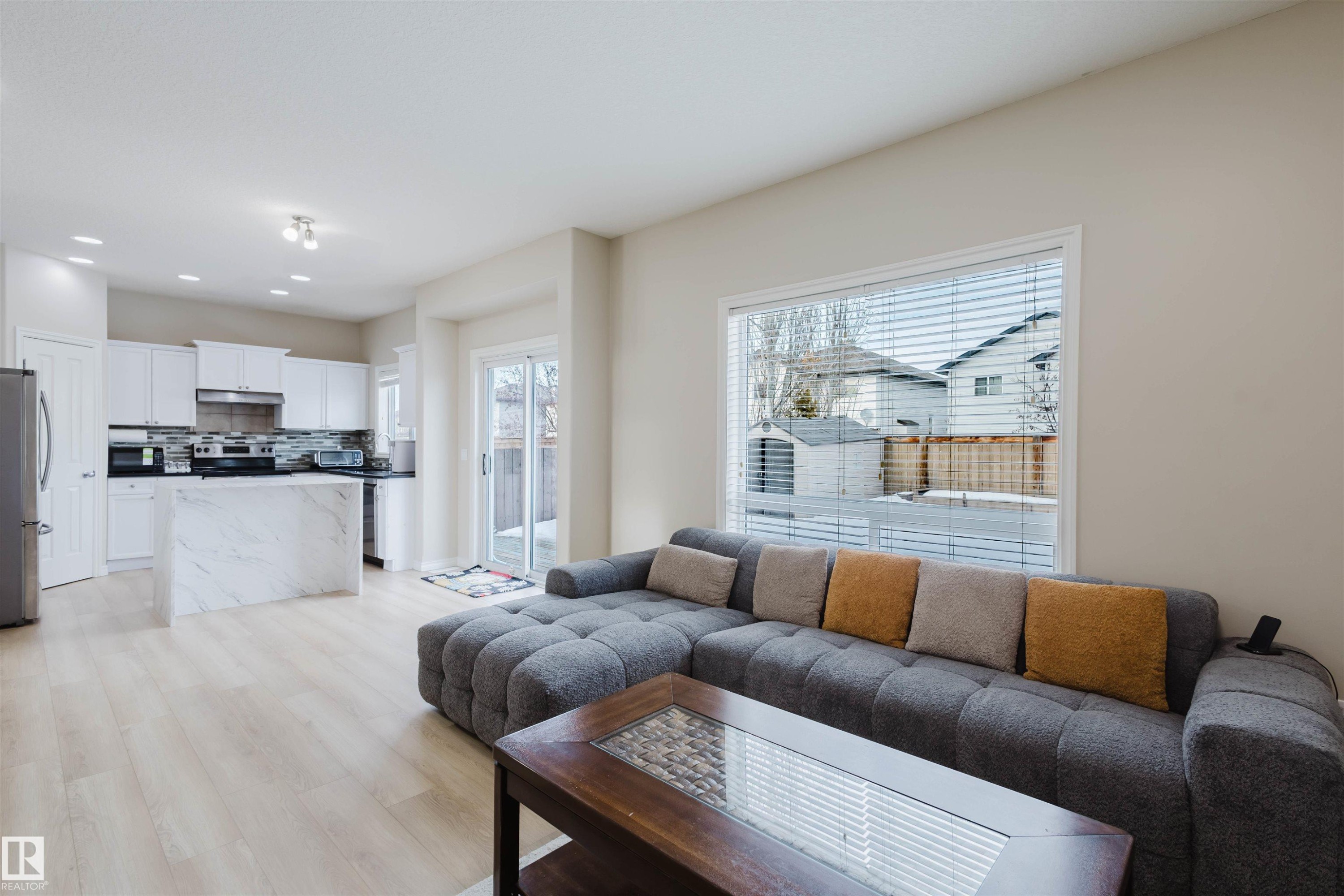 Living room featuring light wood-type flooring and recessed lighting - 8420 Sloane Crescent, Edmonton, AB - Indoor Photo Showing Living Room