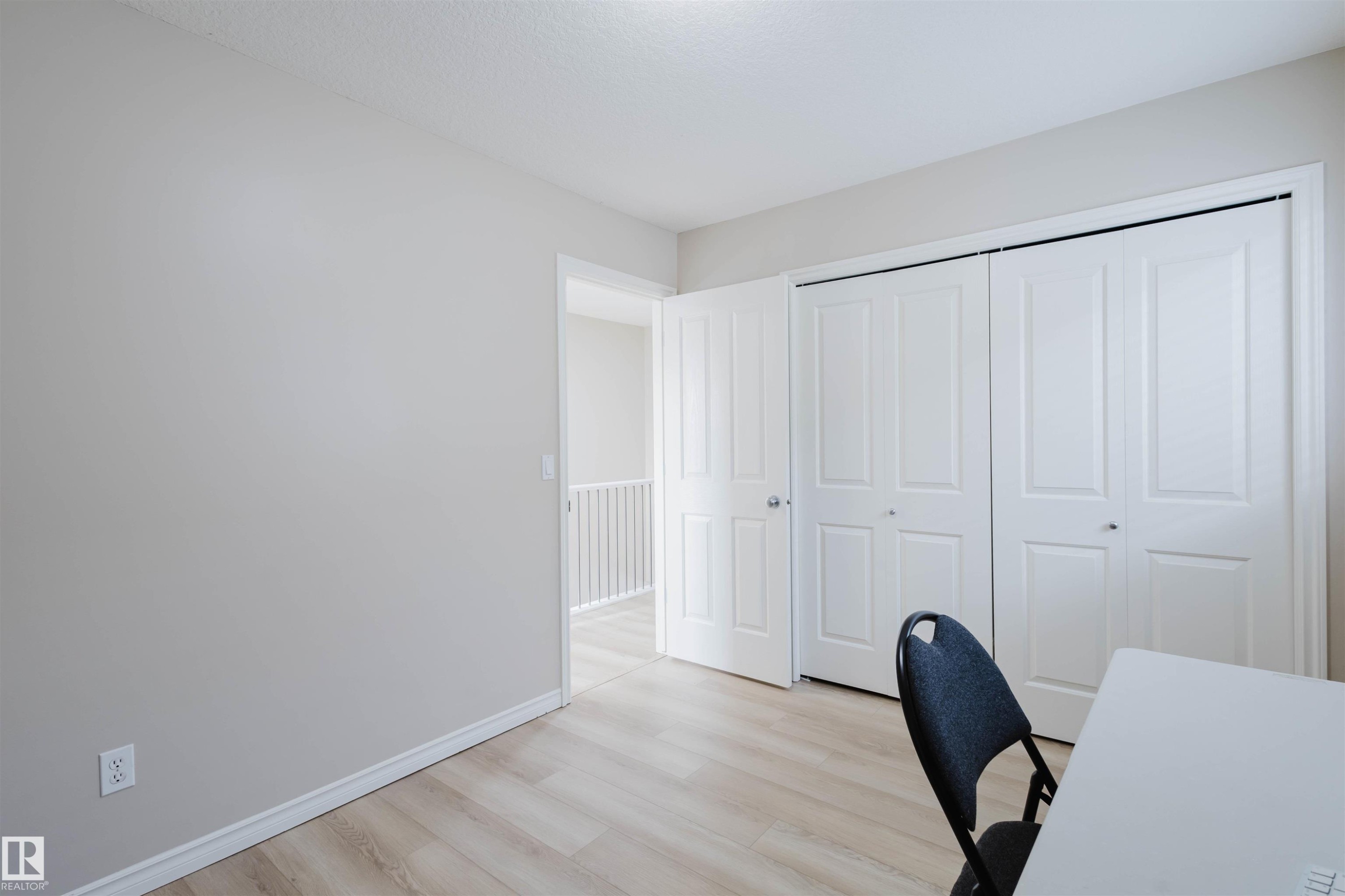 Office space featuring light wood finished floors and baseboards - 8420 Sloane Crescent, Edmonton, AB - Indoor Photo Showing Office