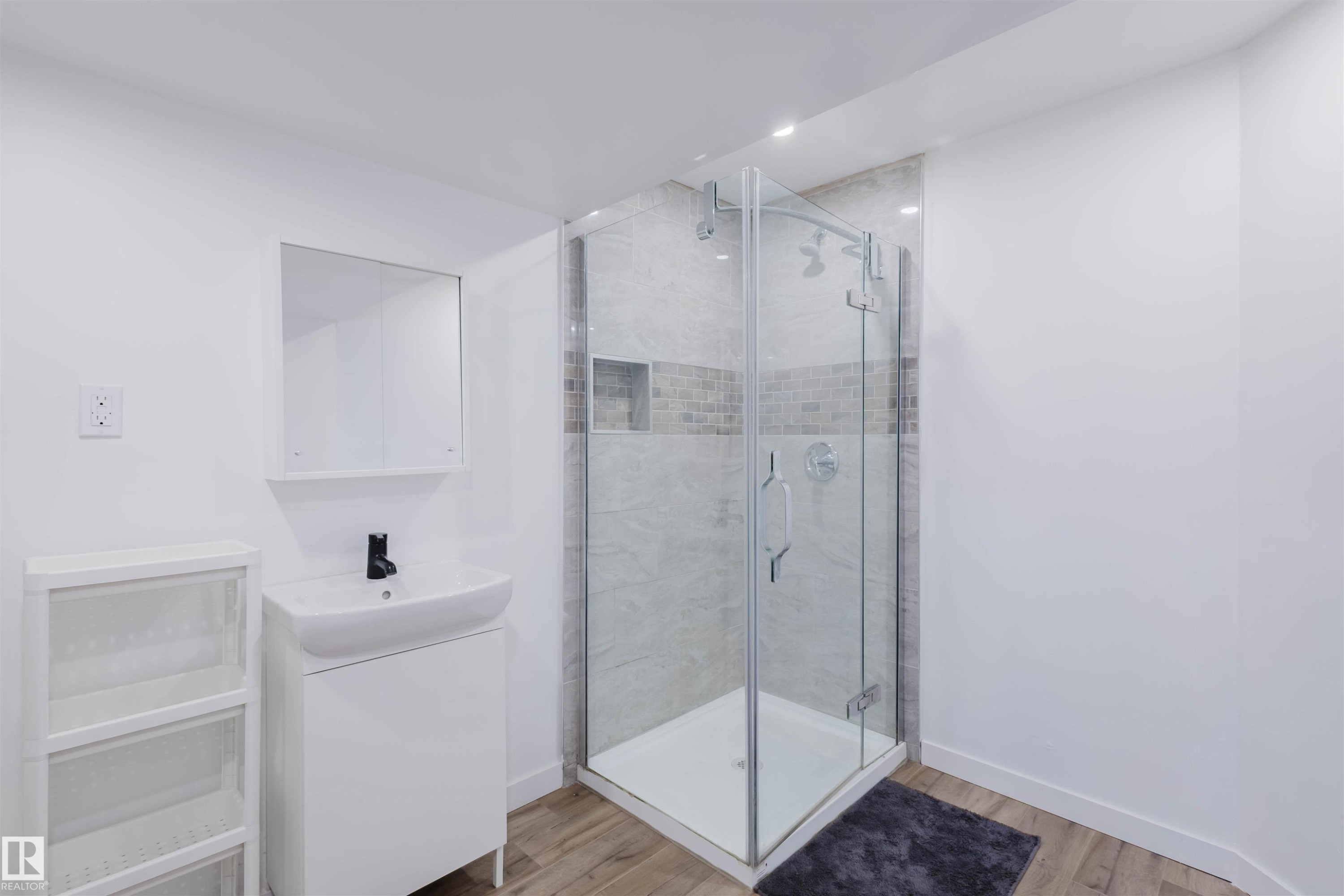 Full bathroom with vanity, a shower stall, and light wood-type flooring - 8420 Sloane Crescent, Edmonton, AB - Indoor Photo Showing Bathroom