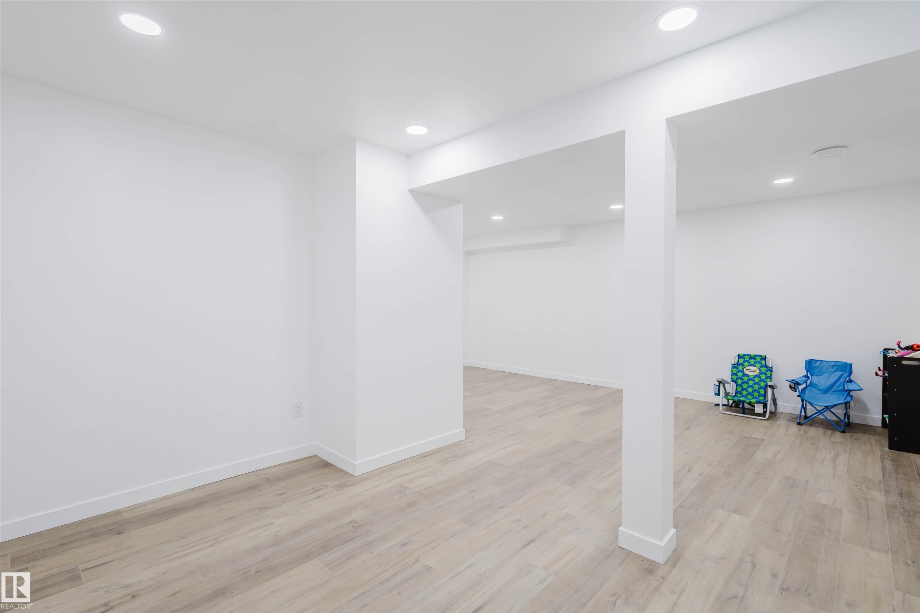 Finished basement with light wood-type flooring and recessed lighting - 8420 Sloane Crescent, Edmonton, AB - Indoor Photo Showing Other Room
