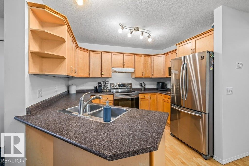 69 Erie Street, Devon, AB - Indoor Photo Showing Kitchen With Double Sink