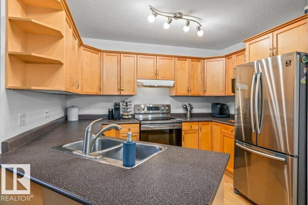 69 Erie Street, Devon, AB - Indoor Photo Showing Kitchen With Double Sink