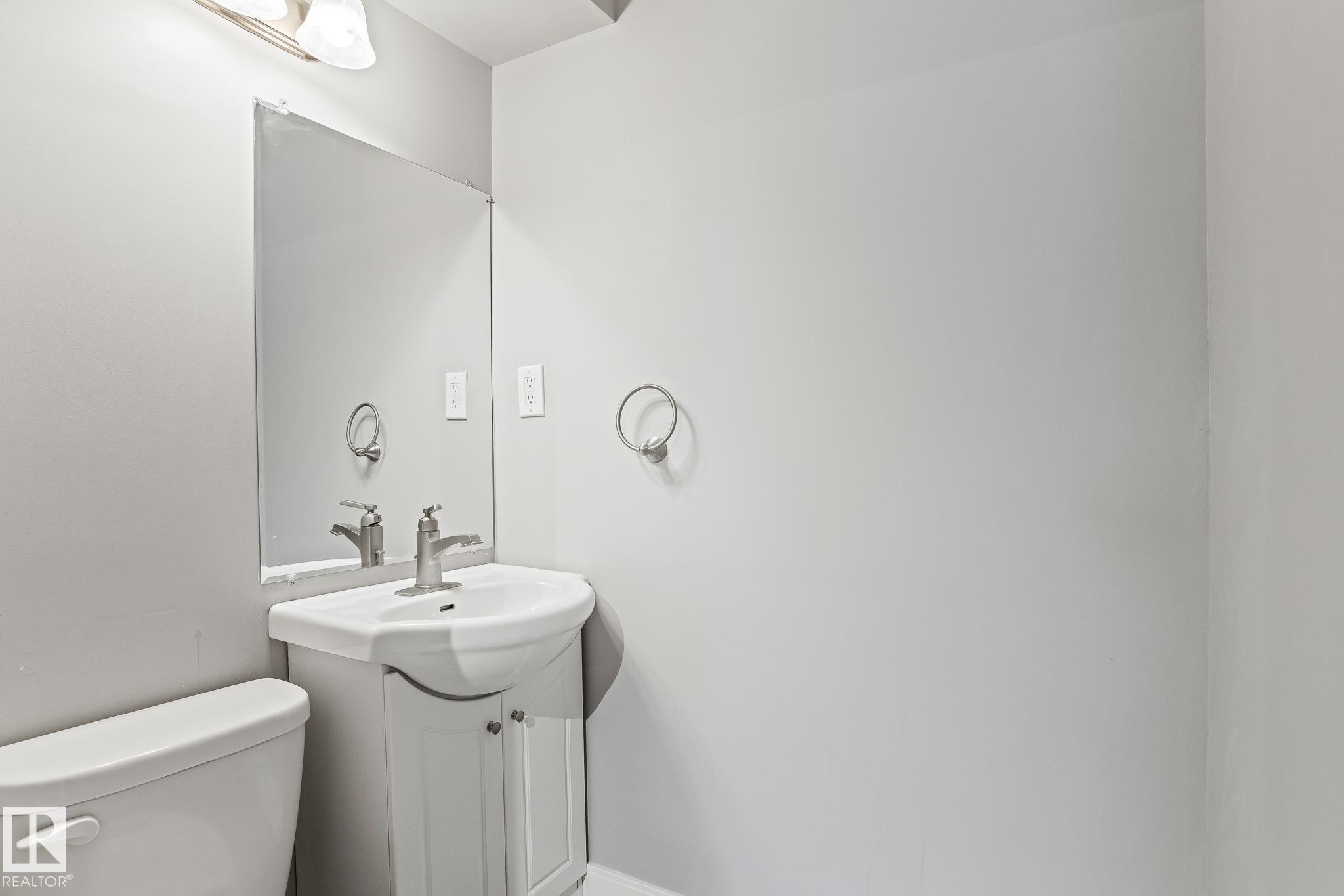 Bathroom with vanity and toilet - 914 9 Street, Cold Lake, AB - Indoor Photo Showing Bathroom