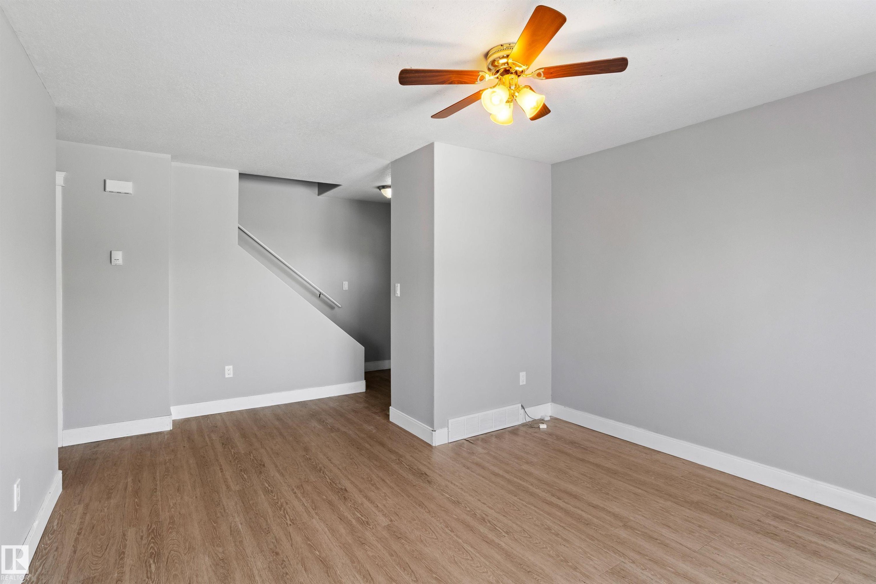 Empty room with light wood-type flooring and a ceiling fan - 914 9 Street, Cold Lake, AB - Indoor Photo Showing Other Room