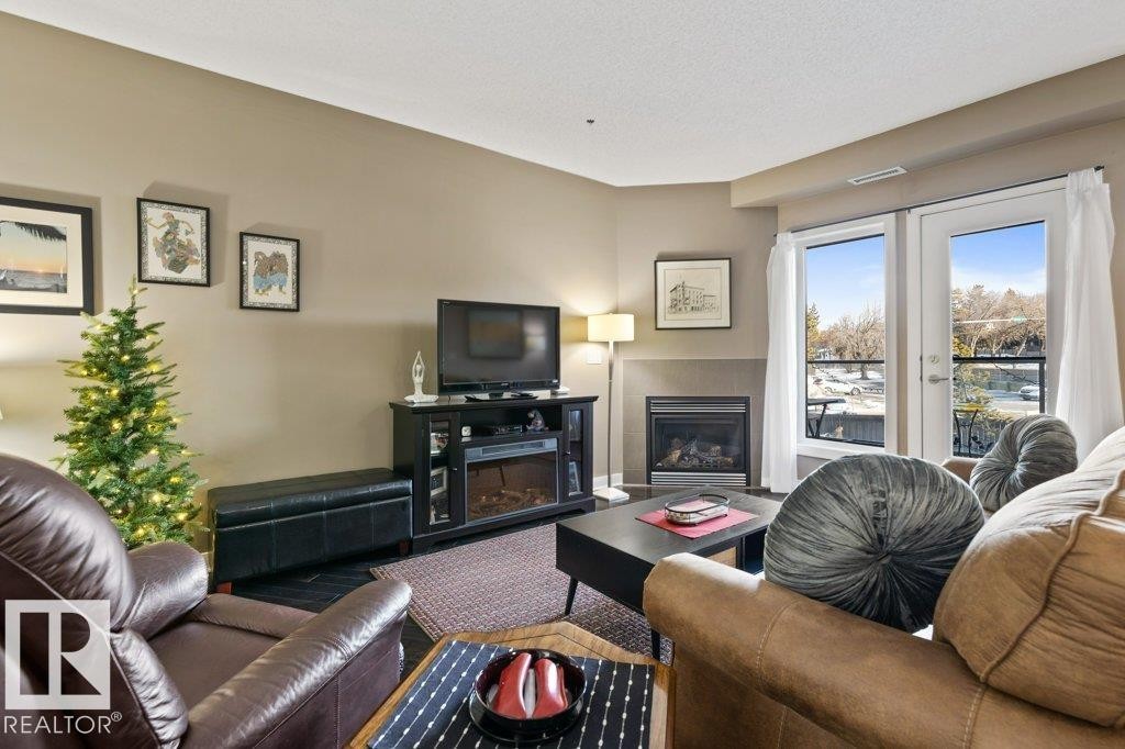 219 35 Sturgeon Road, St. Albert, AB - Indoor Photo Showing Living Room With Fireplace
