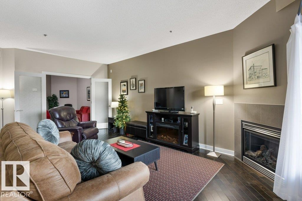 219 35 Sturgeon Road, St. Albert, AB - Indoor Photo Showing Living Room With Fireplace