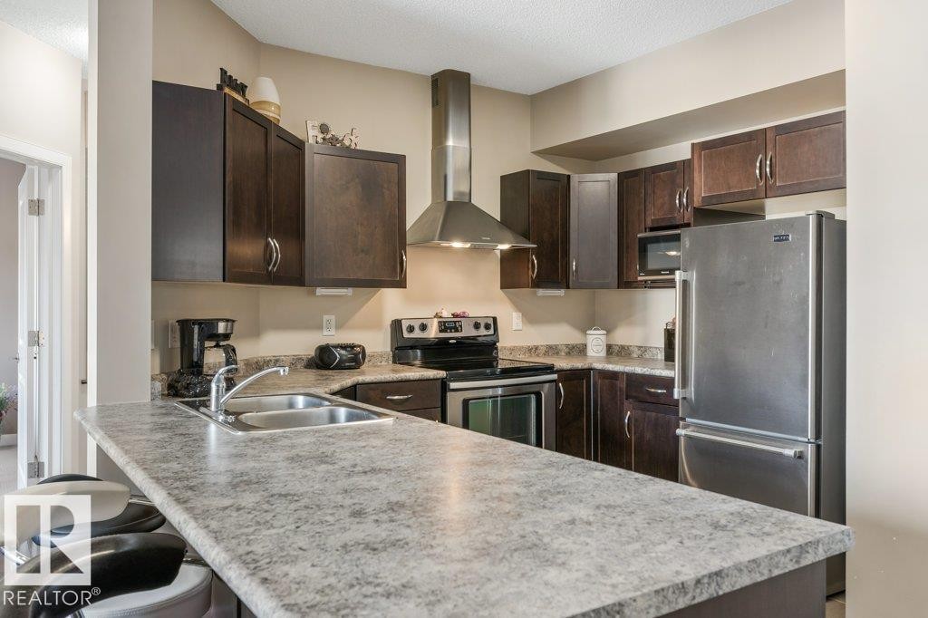 219 35 Sturgeon Road, St. Albert, AB - Indoor Photo Showing Kitchen With Stainless Steel Kitchen With Double Sink With Upgraded Kitchen