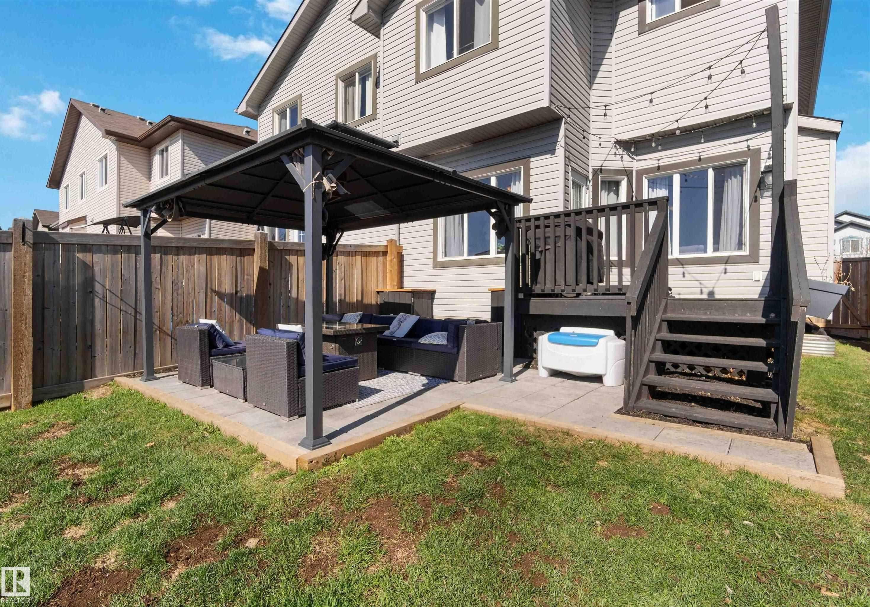Back of property with outdoor lounge area, a patio, a gazebo, a fenced backyard, and a wooden deck - 1965 118 Street, Edmonton, AB - Outdoor With Deck Patio Veranda