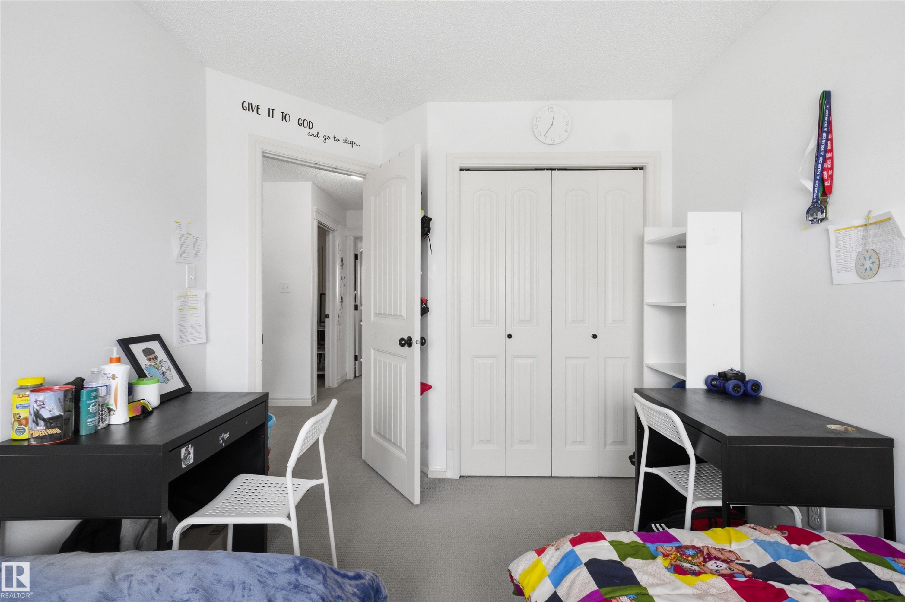 Bedroom featuring a closet and dark colored carpet - 1965 118 Street, Edmonton, AB - Indoor Photo Showing Bedroom