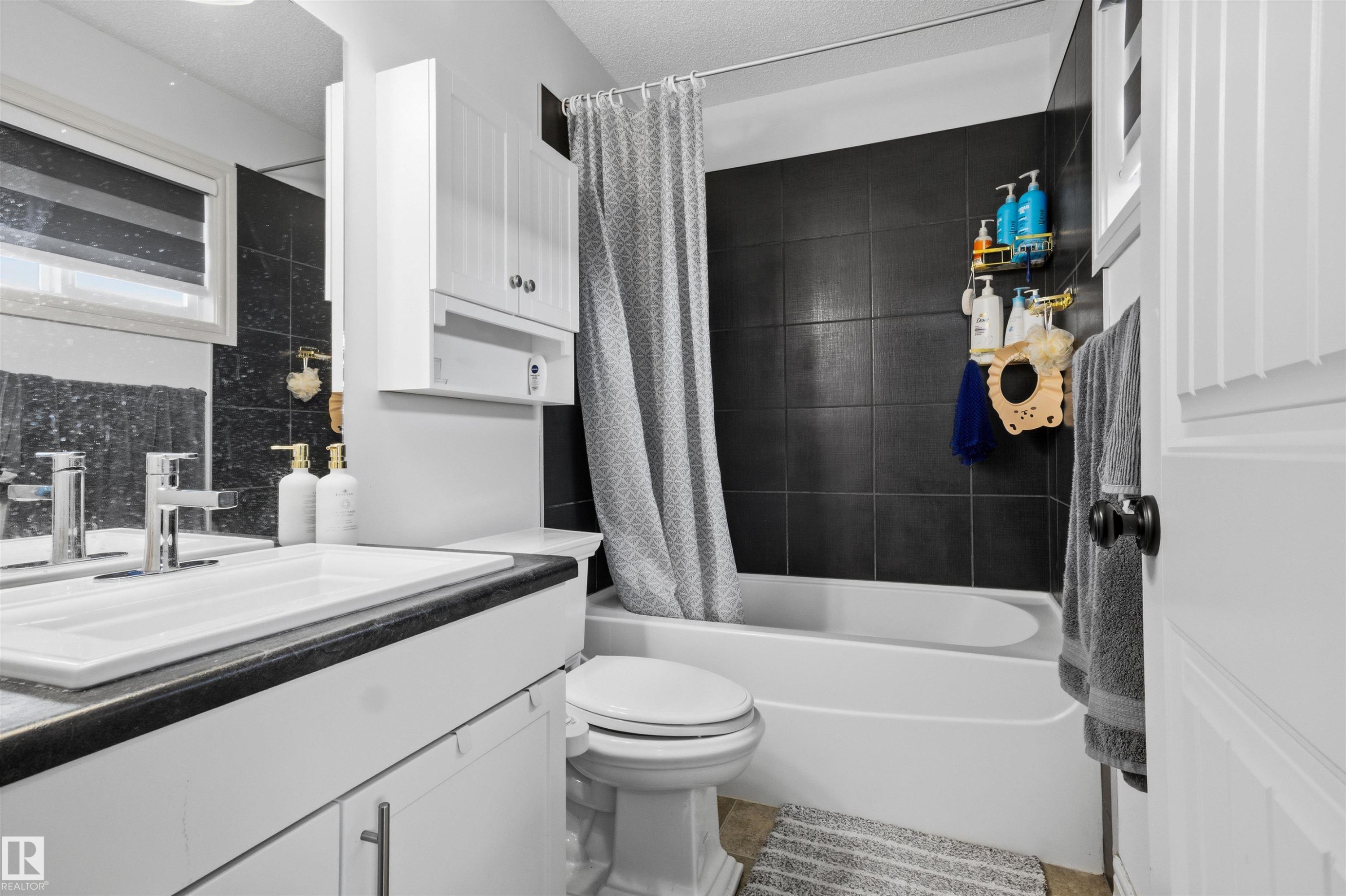 Bathroom with vanity and shower / tub combo - 1965 118 Street, Edmonton, AB - Indoor Photo Showing Bathroom