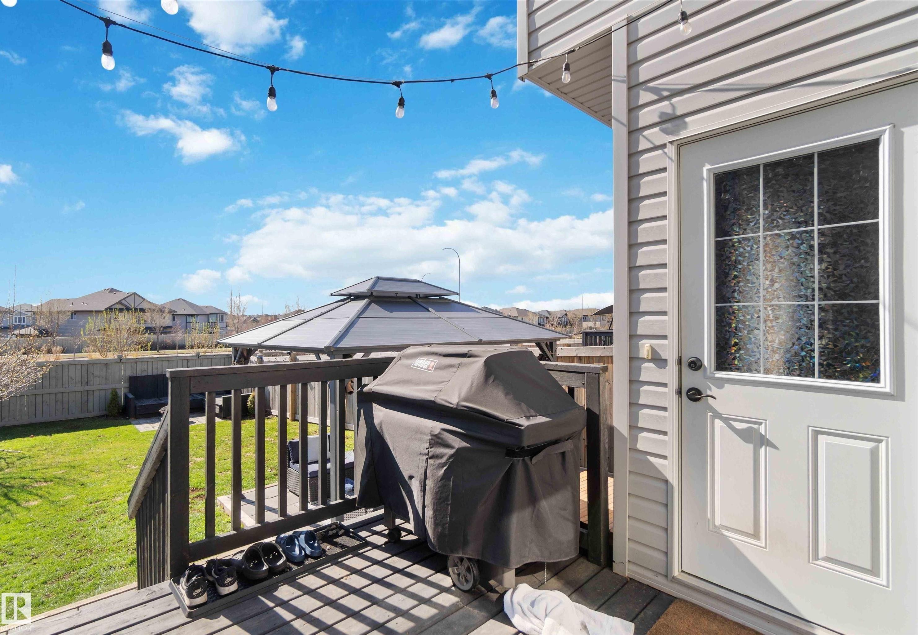 Wooden terrace featuring grilling area and a residential view - 1965 118 Street, Edmonton, AB - Outdoor With Deck Patio Veranda With Exterior