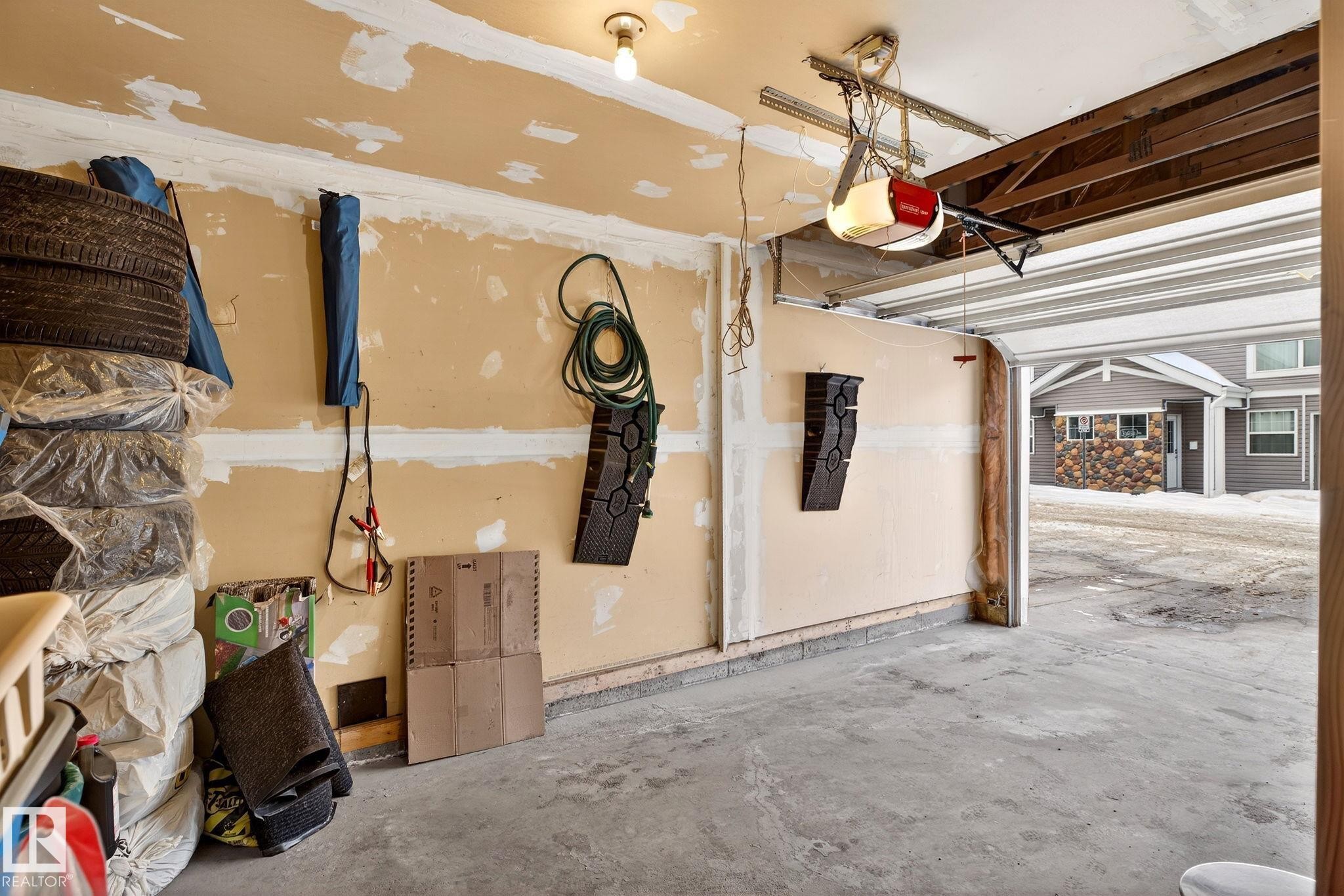 108 150 Edwards Drive, Edmonton, AB - Indoor Photo Showing Garage