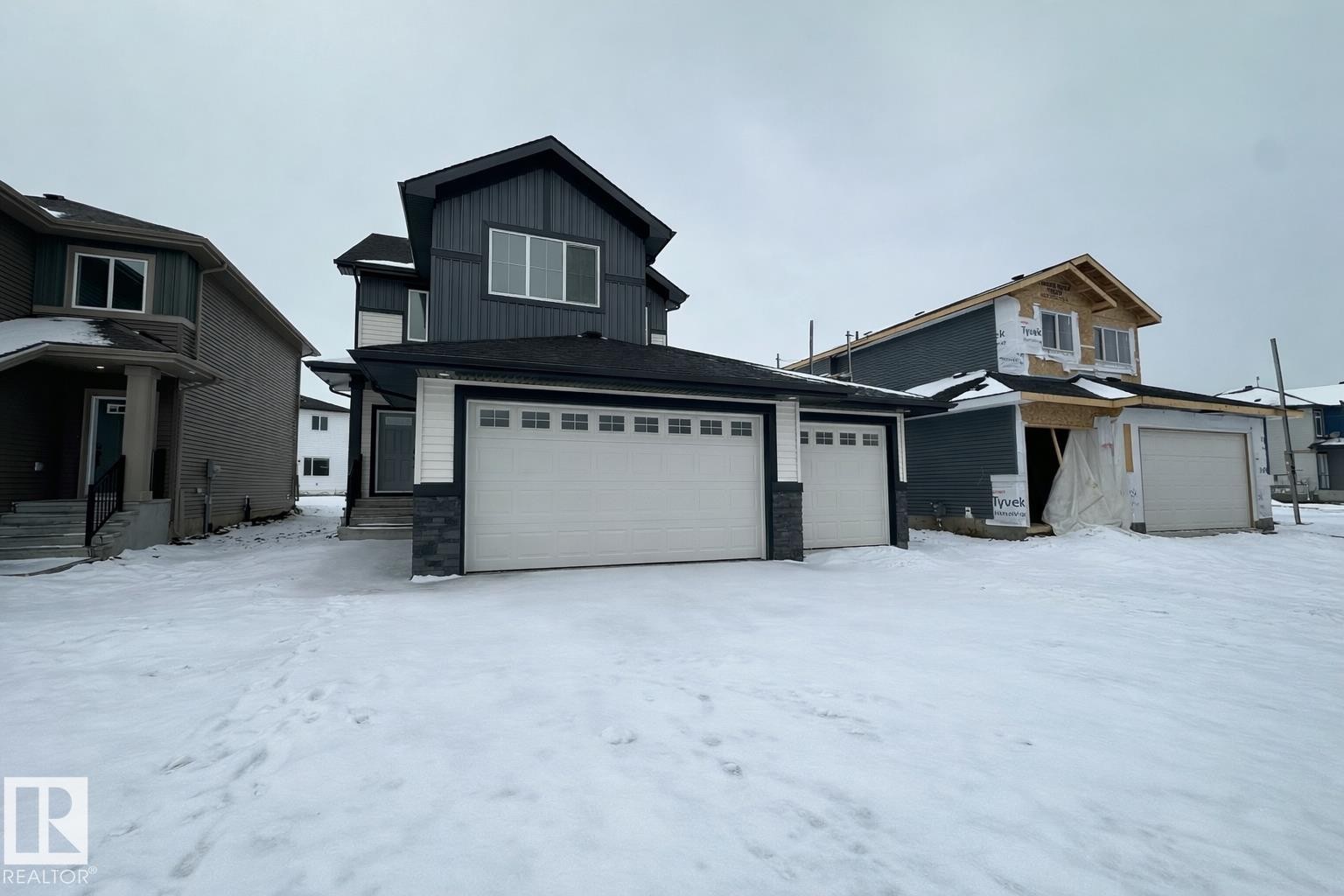 223 Ravine Drive, Devon, AB - Outdoor With Facade