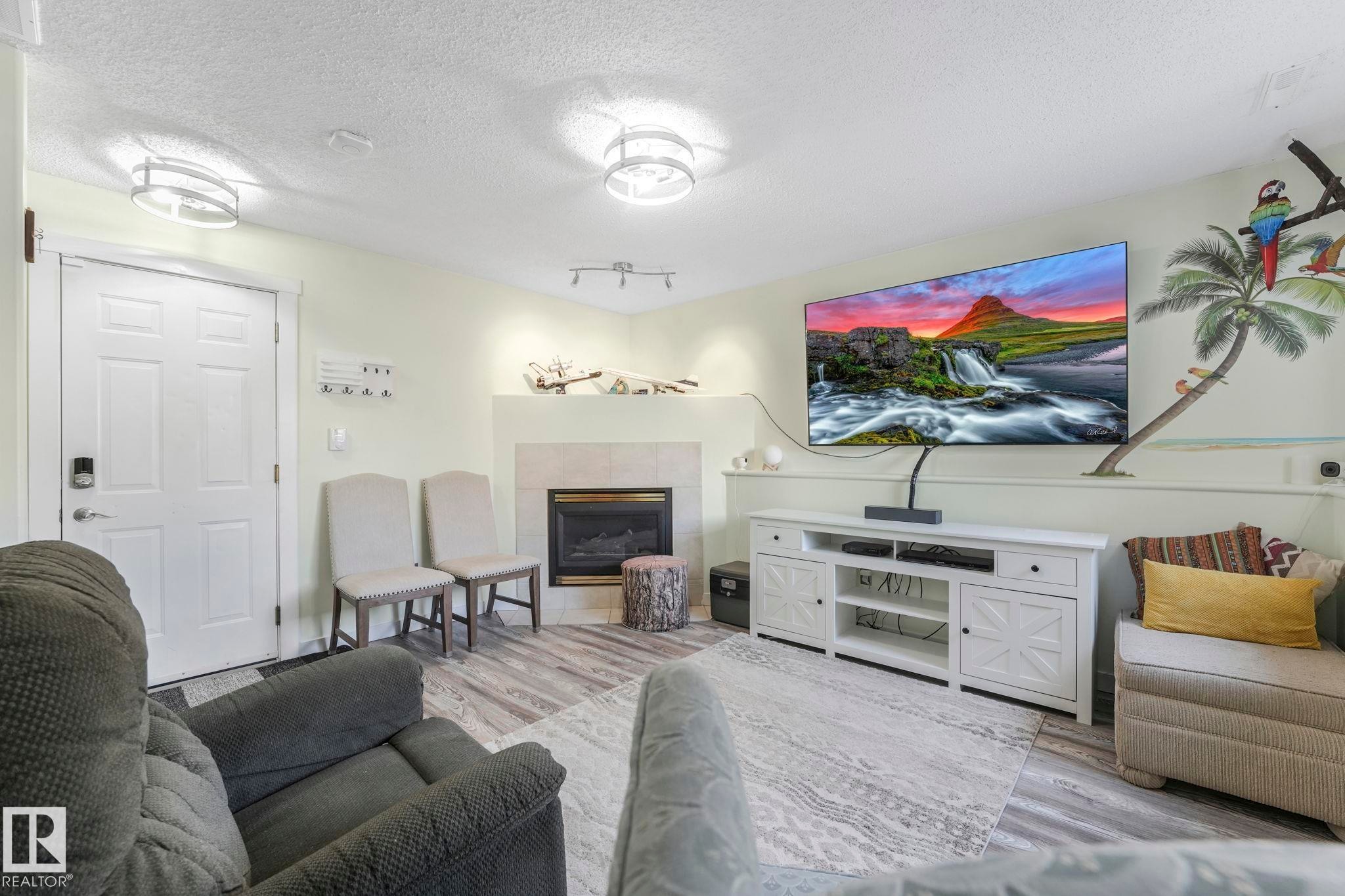 24 2419 133 Avenue, Edmonton, AB - Indoor Photo Showing Living Room With Fireplace