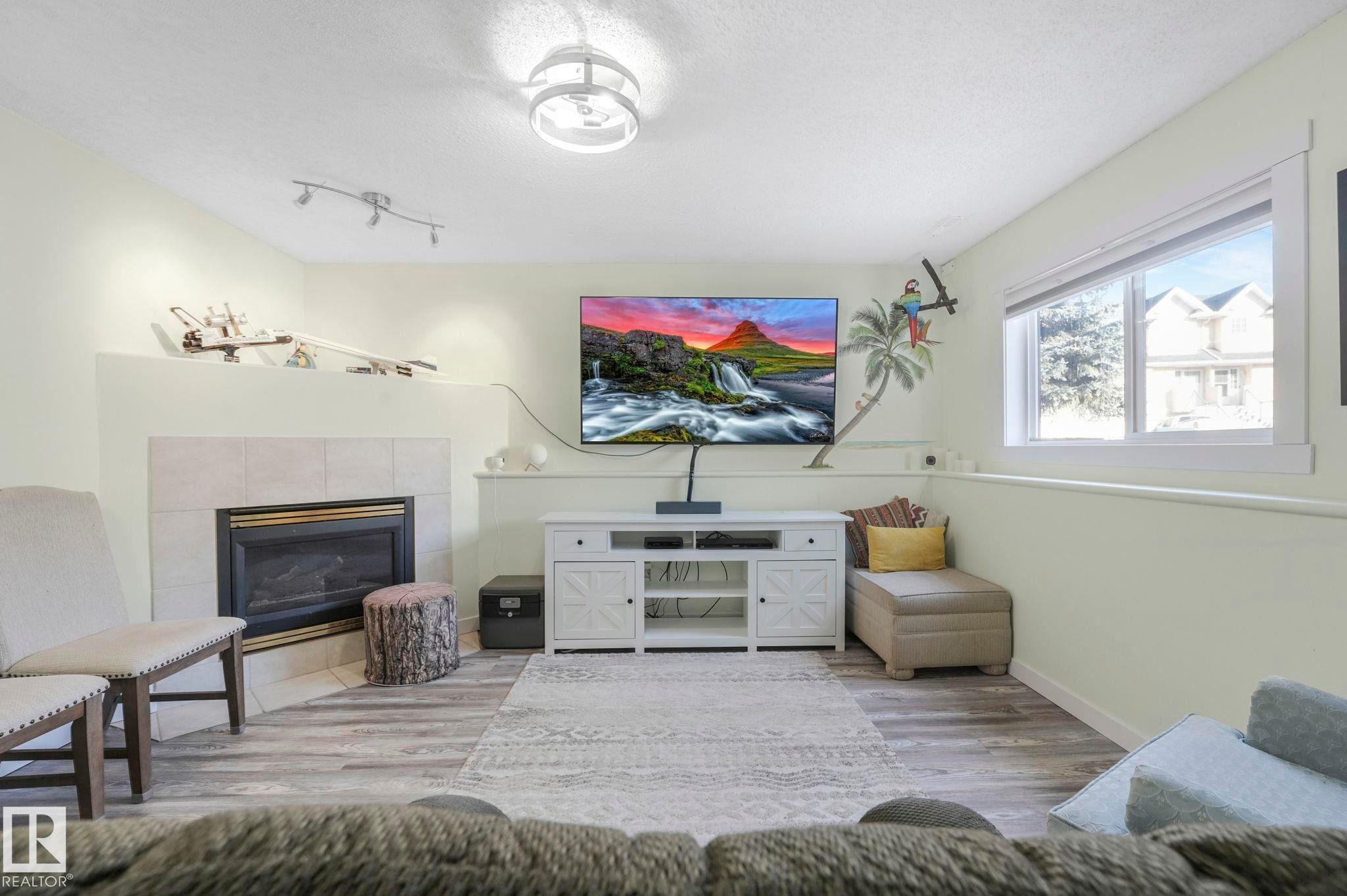 24 2419 133 Avenue, Edmonton, AB - Indoor Photo Showing Other Room With Fireplace