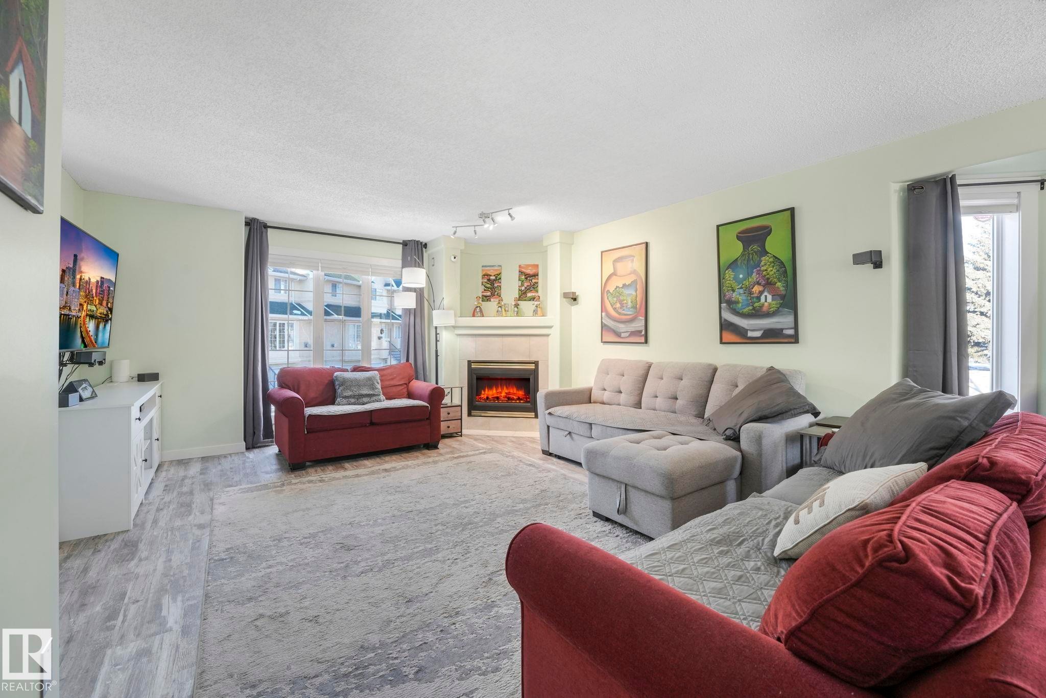 24 2419 133 Avenue, Edmonton, AB - Indoor Photo Showing Living Room With Fireplace