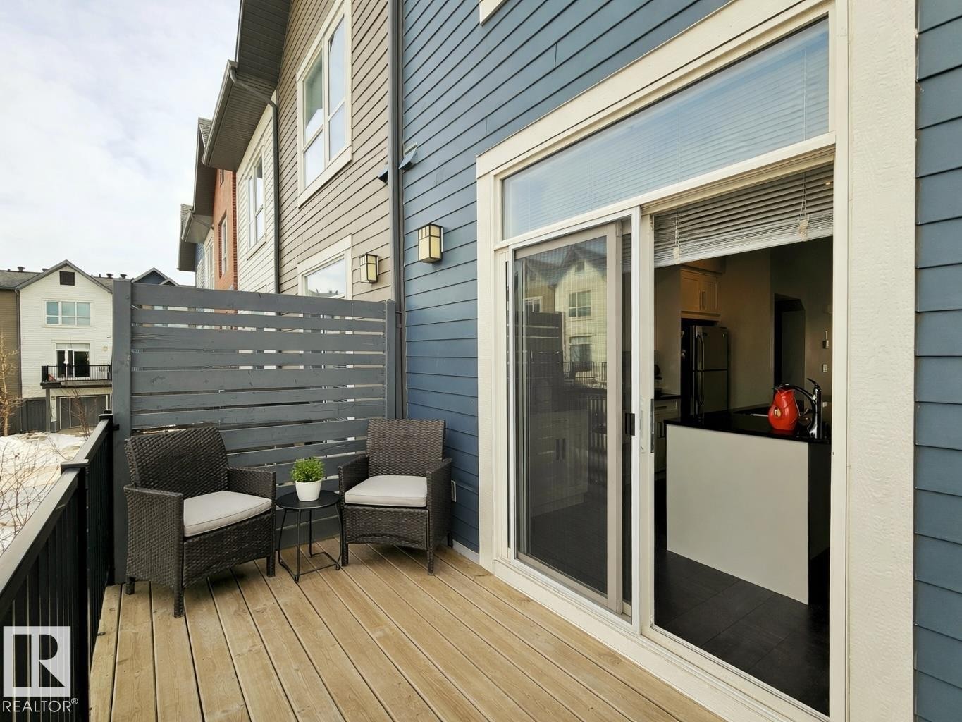 View of wooden deck - 129 2560 Pegasus Boulevard, Edmonton, AB - Outdoor With Exterior