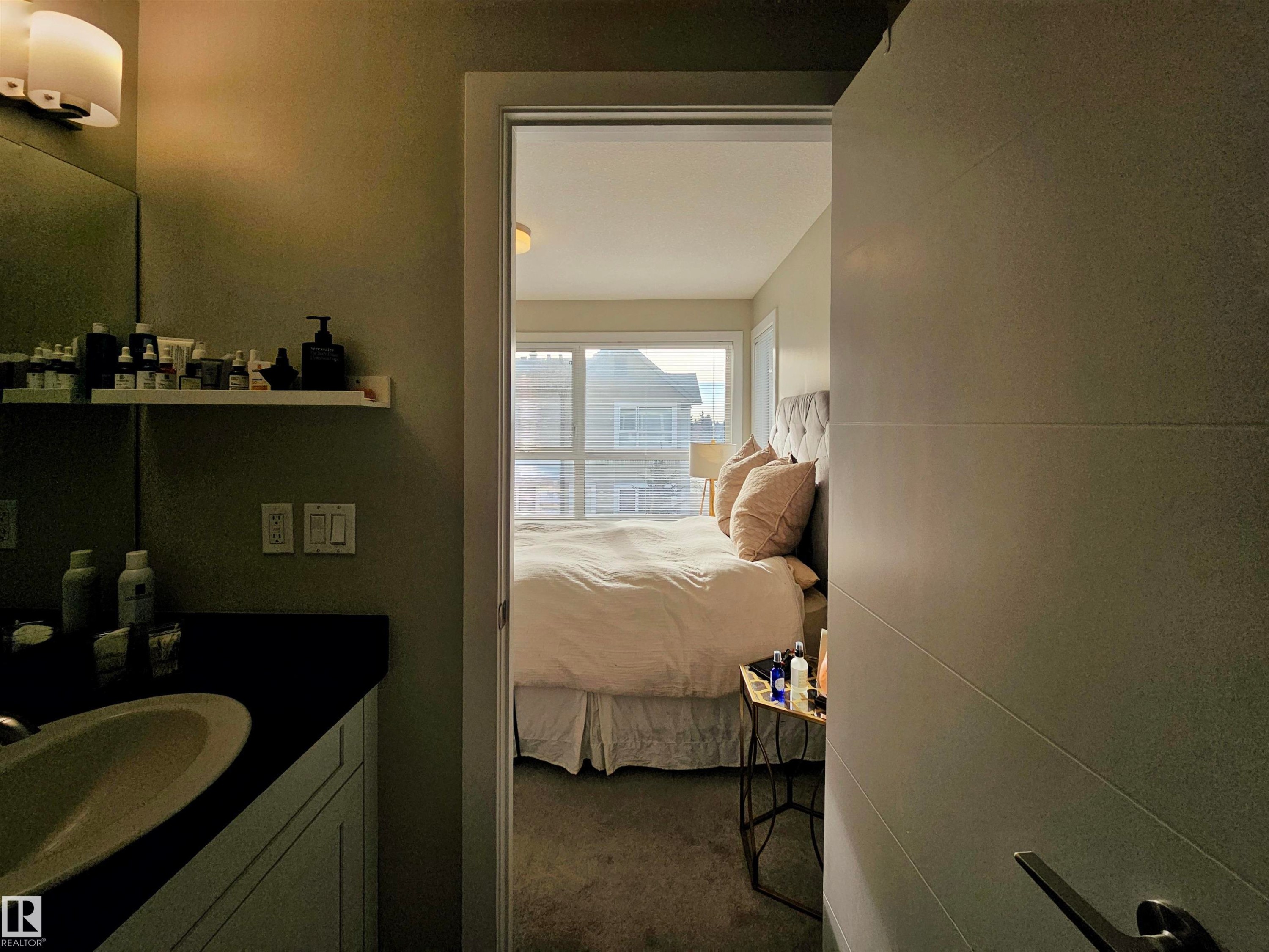 Ensuite bathroom with vanity and dark colored carpet - 129 2560 Pegasus Boulevard, Edmonton, AB - Indoor Photo Showing Bathroom
