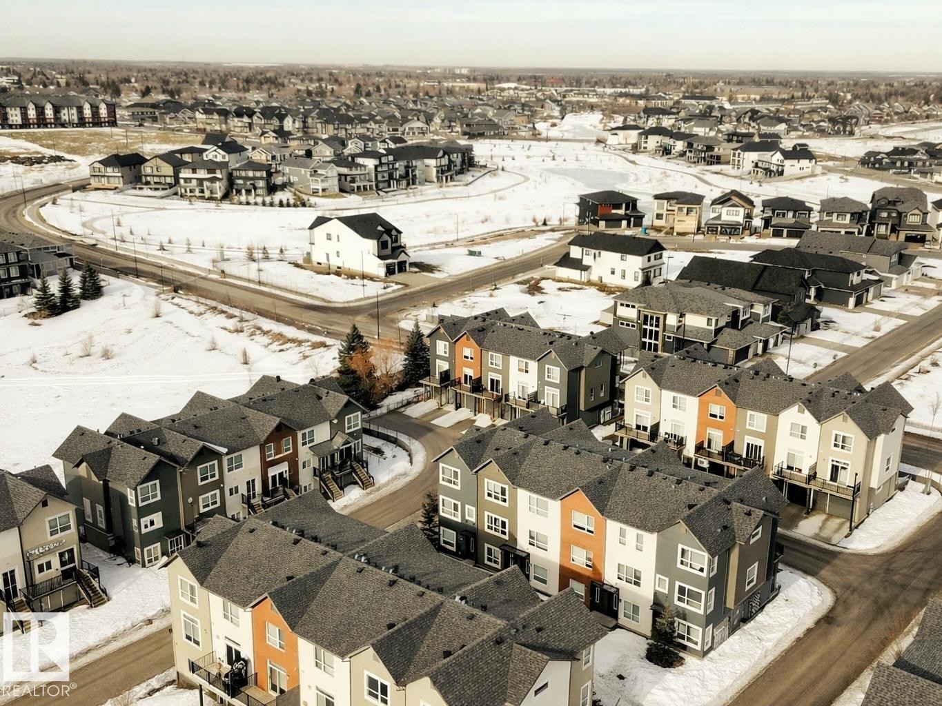 Aerial view of property and surrounding area featuring nearby suburban area - 129 2560 Pegasus Boulevard, Edmonton, AB - With View