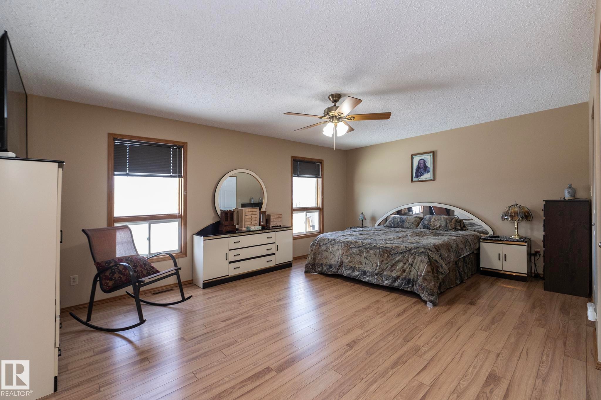 Loads of space in this private sanctuary; comes with its own spa-like retreat in its ensuite.... also separate his/hers closets too. - 57524 Range Road 270, Rural Westlock County, AB - Indoor Photo Showing Bedroom