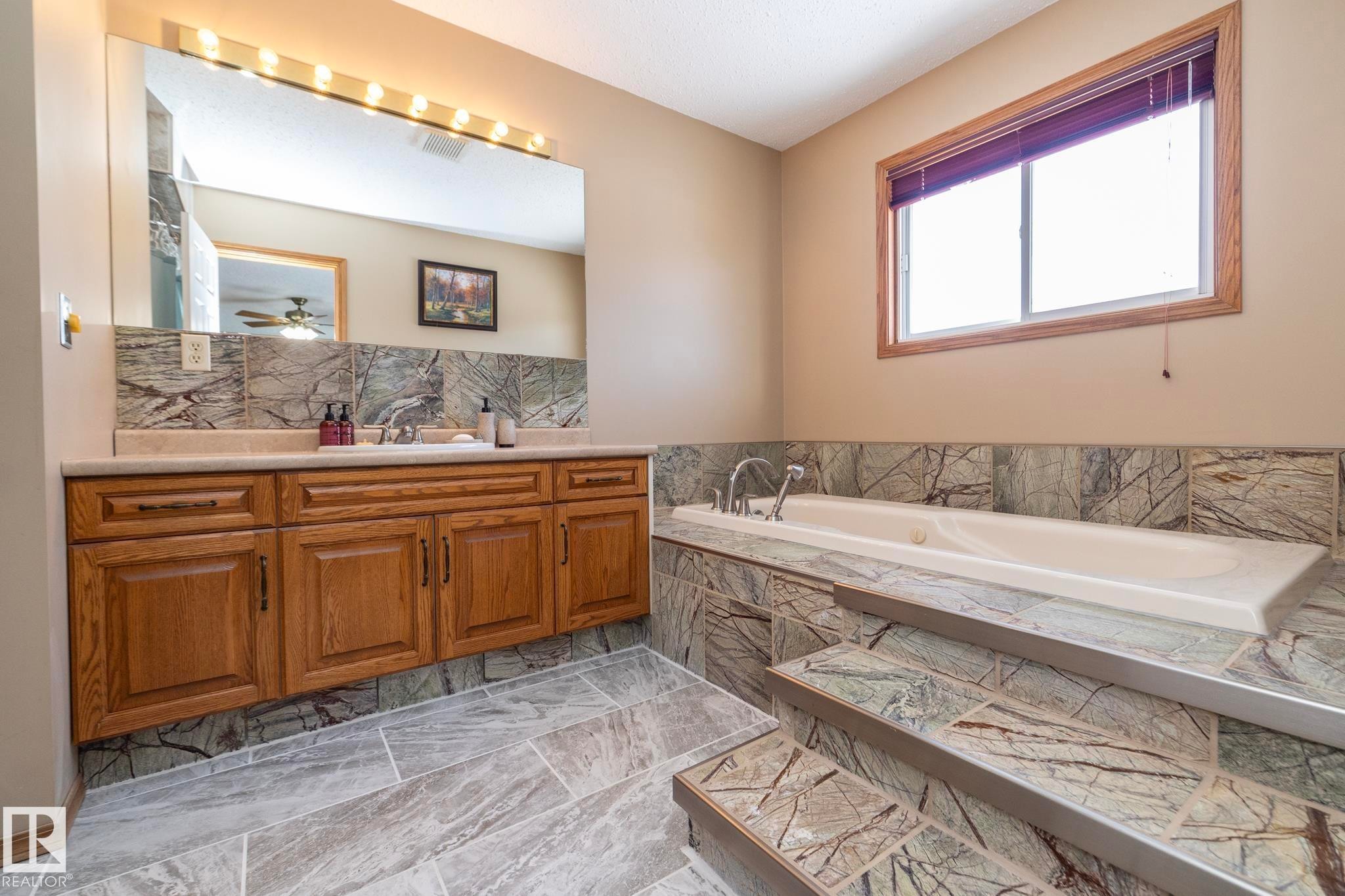 Soak in it and let the pampering begin! Fabulous sunken tub to relax and let everything else "wash away". - 57524 Range Road 270, Rural Westlock County, AB - Indoor Photo Showing Bathroom