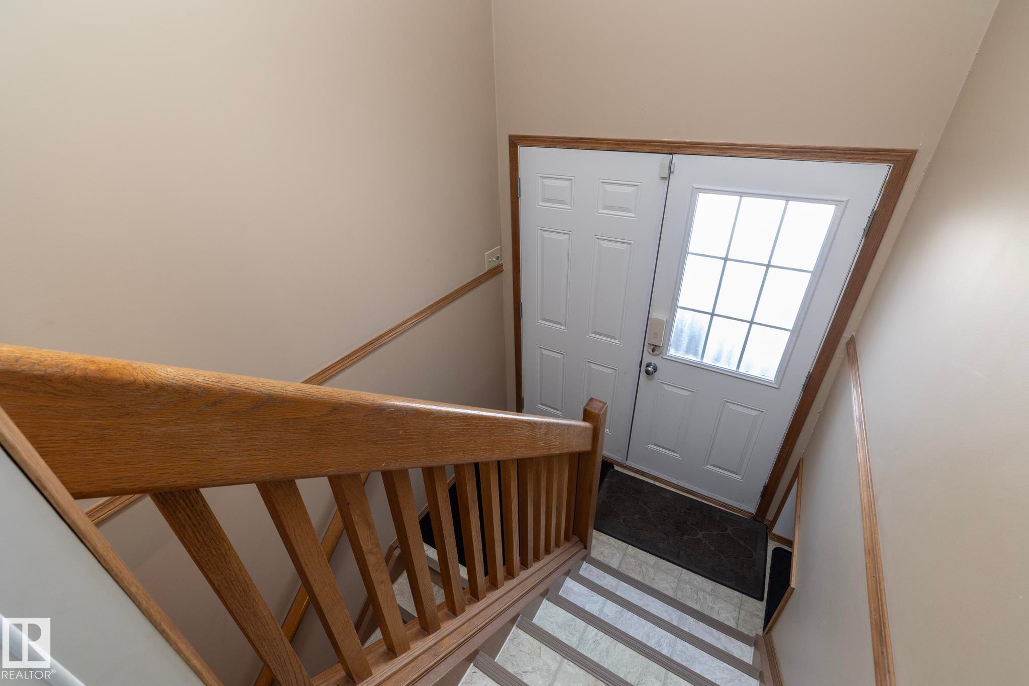 This stairway is located in the hallway, just off the kitchen & entry from garage. Exterior door leads to the concrete patio. Let's see where the stairs lead to.......... - 57524 Range Road 270, Rural Westlock County, AB - Indoor Photo Showing Other Room