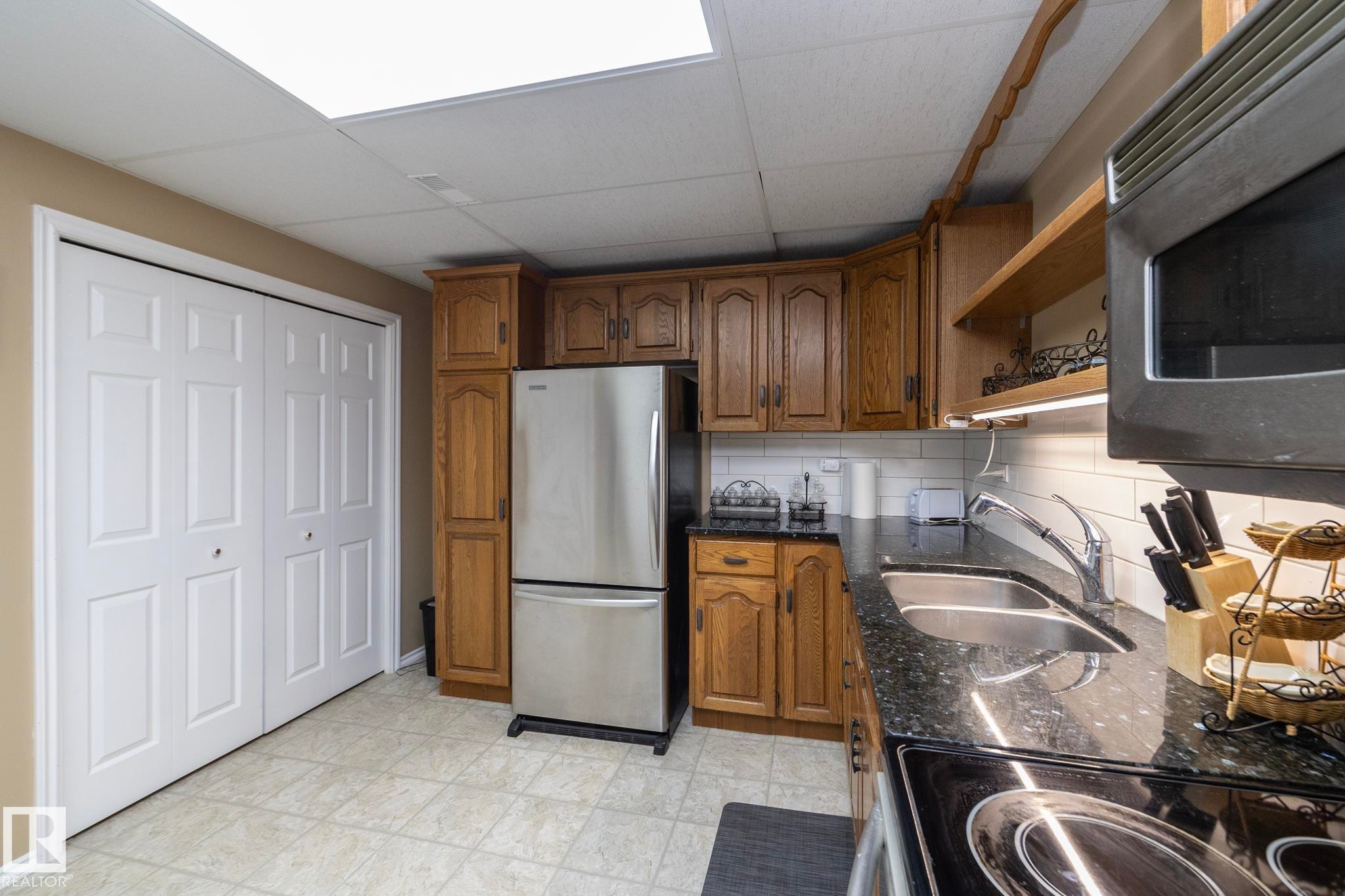 Additional storage space, alleviates clutter on the counters. - 57524 Range Road 270, Rural Westlock County, AB - Indoor Photo Showing Kitchen With Double Sink