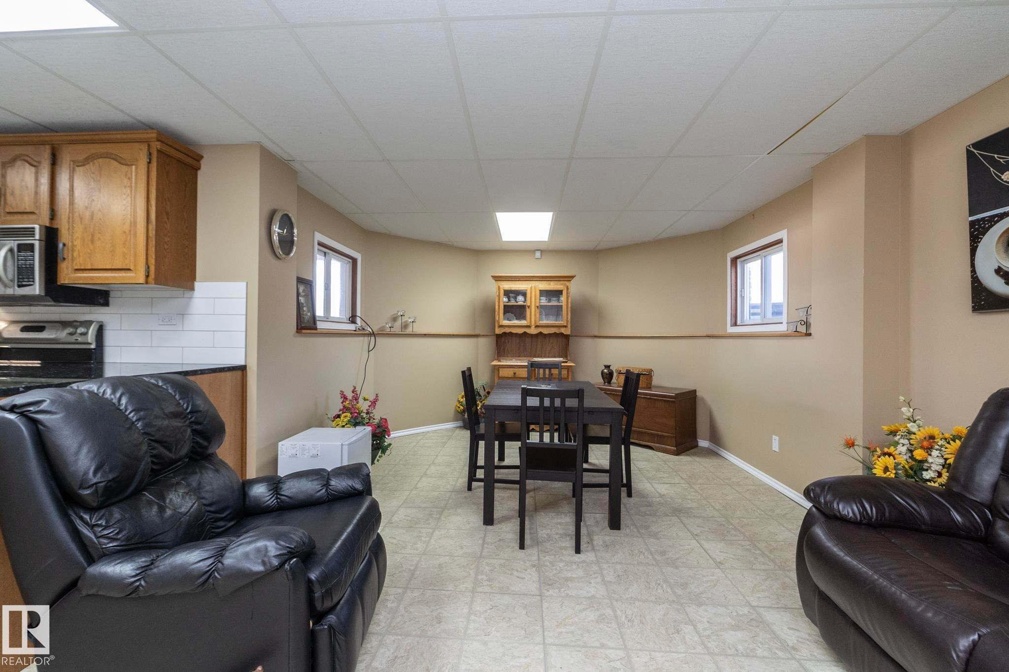 Sitting area, just inside the lower entryway, near the kitchen and table - 57524 Range Road 270, Rural Westlock County, AB - Indoor Photo Showing Basement