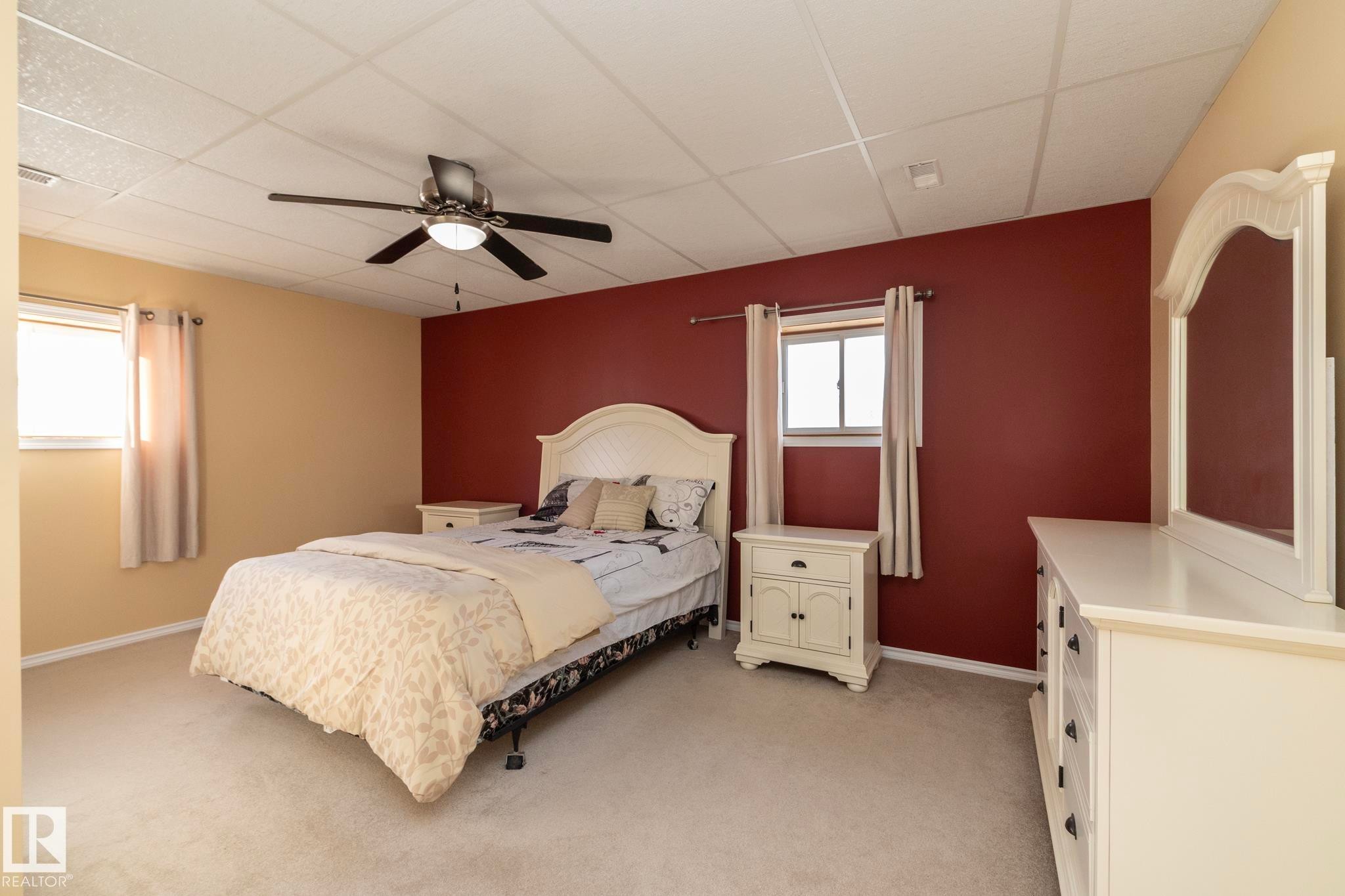 2nd of the large bedrooms located on the lower level of this home. More than able to house good sized furniture, no matter the age of the lucky one who gets this room! Also a West facing window, allowing natural light. - 57524 Range Road 270, Rural Westlock County, AB - Indoor Photo Showing Bedroom