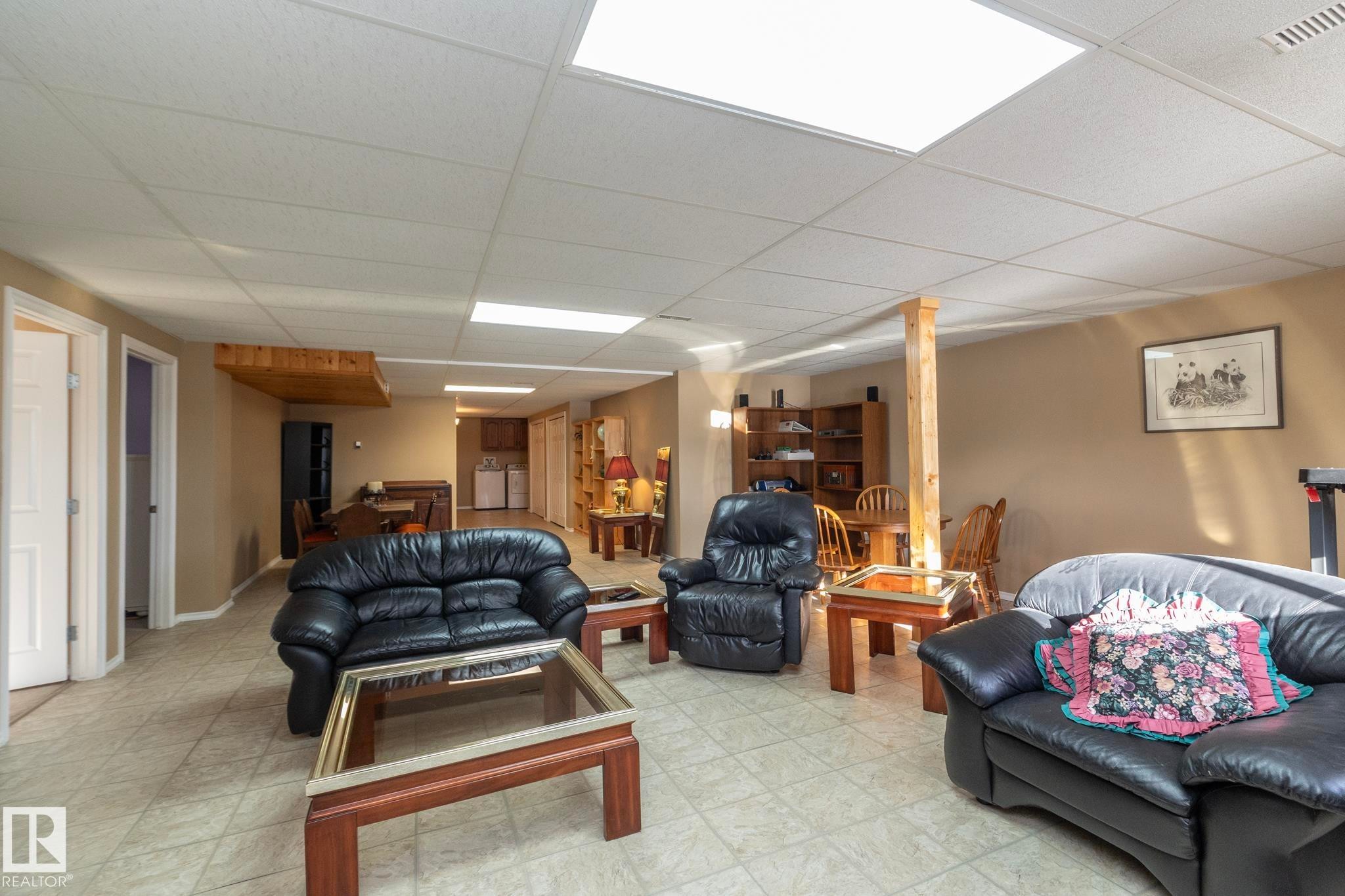 Lots of space here too! Great family area whether for movies, games, puzzles, etc. Easy clean flooring, in case of spills, etc. - 57524 Range Road 270, Rural Westlock County, AB - Indoor