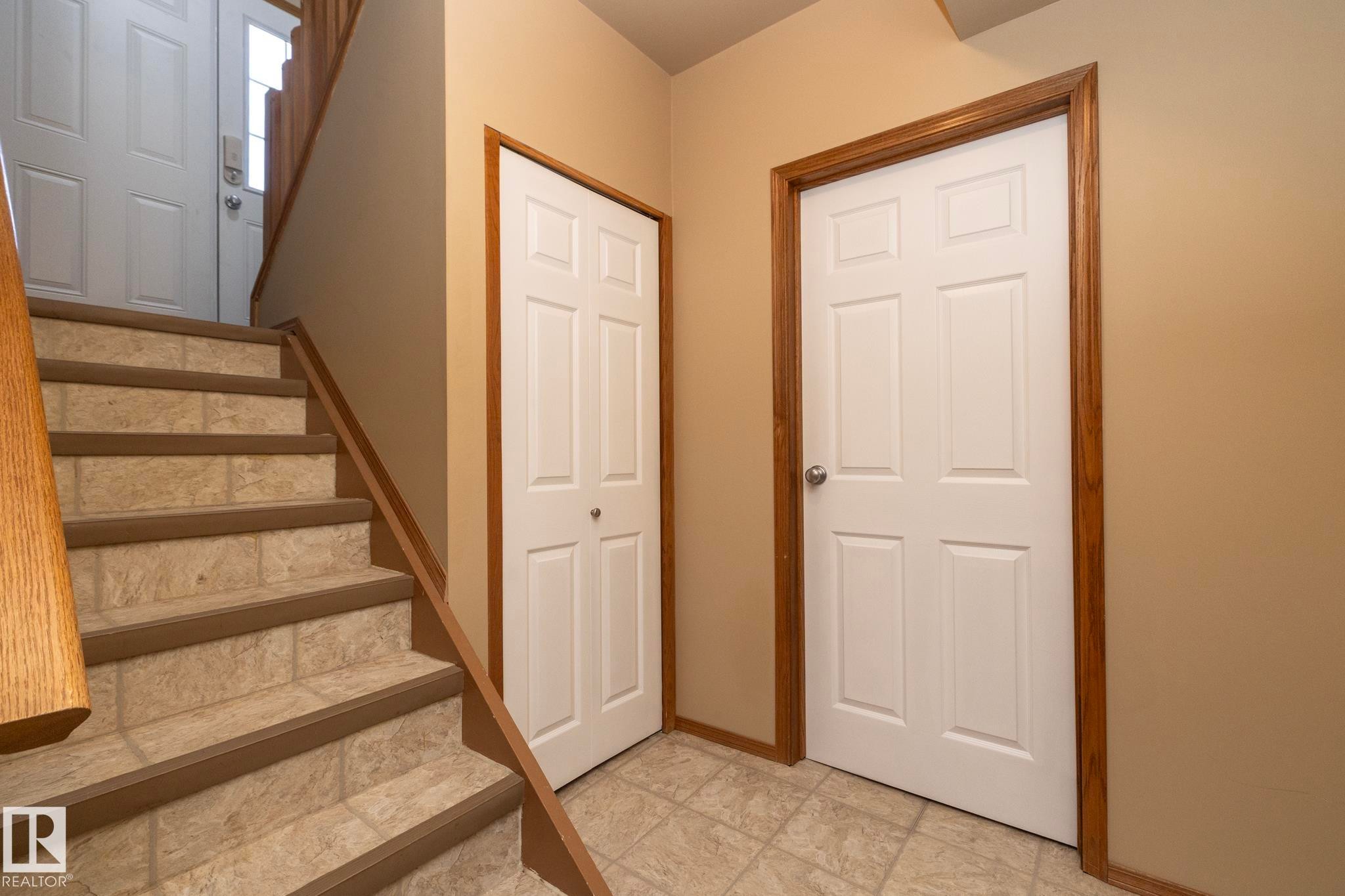 Stairway up/down from back entry way and to the upper level. - 57524 Range Road 270, Rural Westlock County, AB - Indoor Photo Showing Other Room