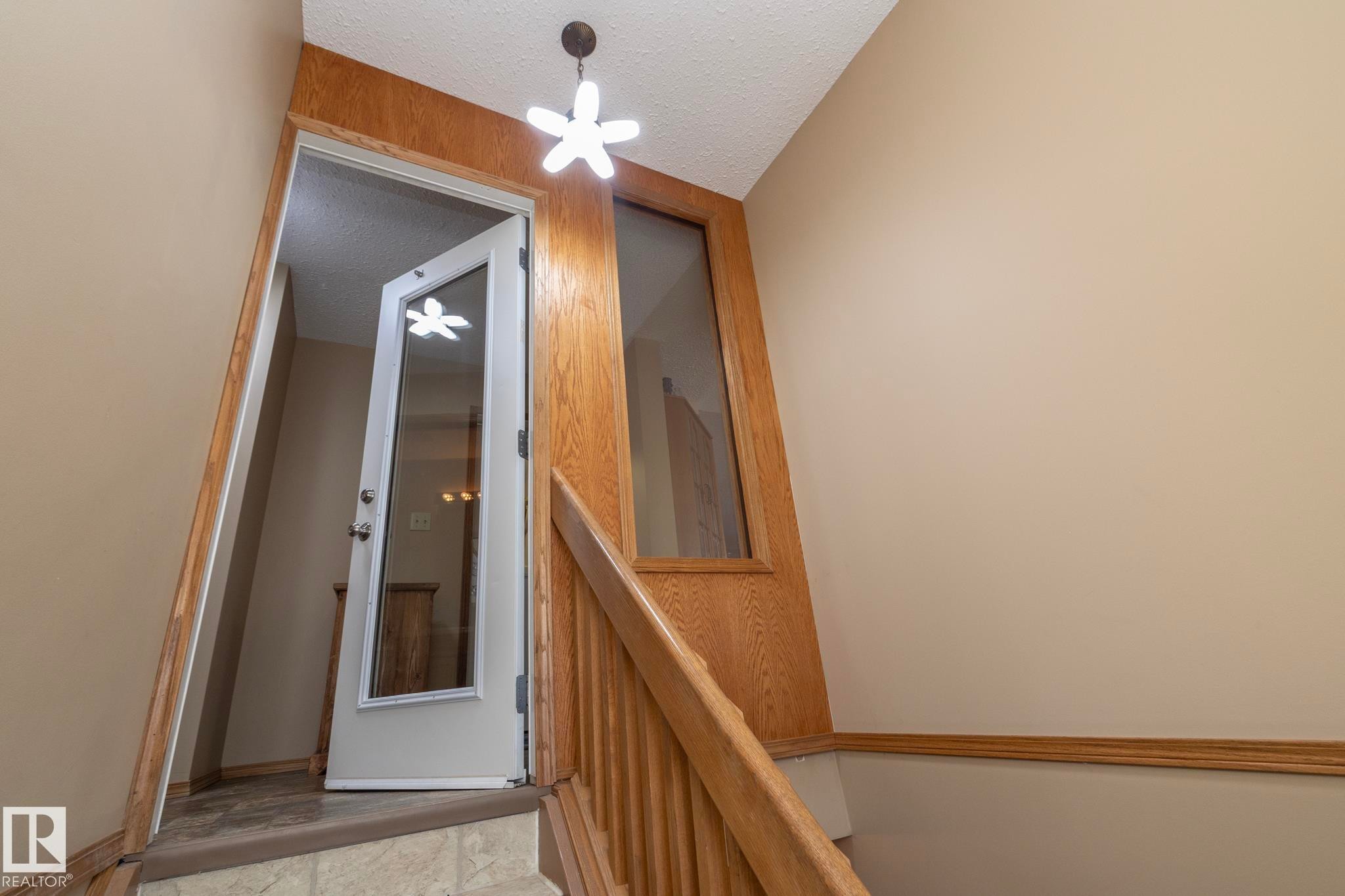 Doorway at top of the stairs takes you to the hallway at the main level. - 57524 Range Road 270, Rural Westlock County, AB - Indoor Photo Showing Other Room