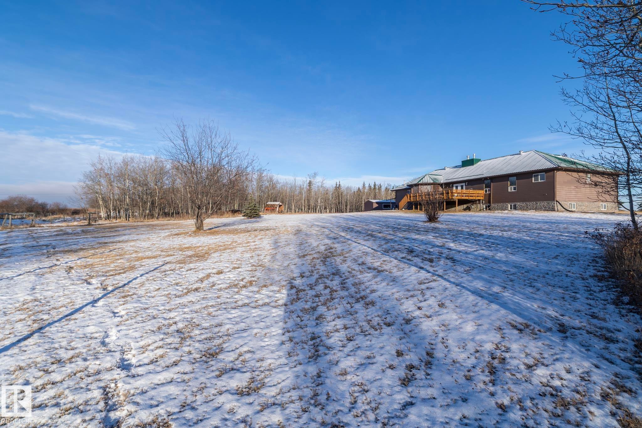 View of back yard....taken from where the small pond is located, to the South of the house - 57524 Range Road 270, Rural Westlock County, AB - Outdoor With View