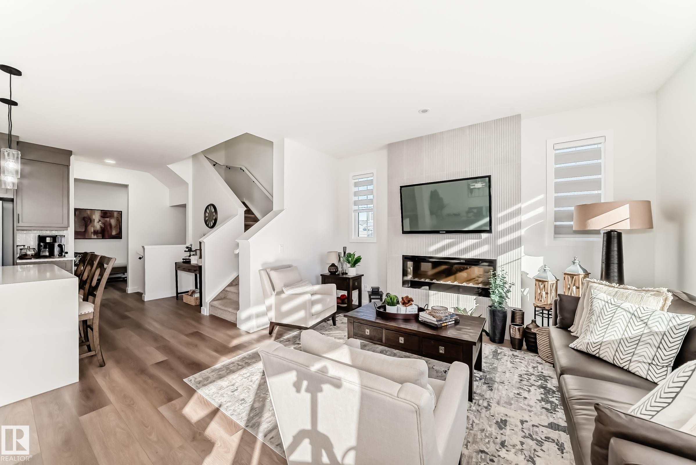 Living room with light wood-type flooring and recessed lighting - 3569 Erlanger Link, Edmonton, AB - Indoor Photo Showing Living Room With Fireplace