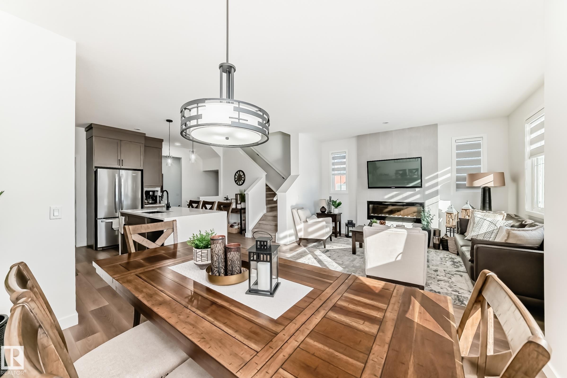 Dining area with dark wood finished floors and a fireplace - 3569 Erlanger Link, Edmonton, AB - Indoor Photo Showing Dining Room