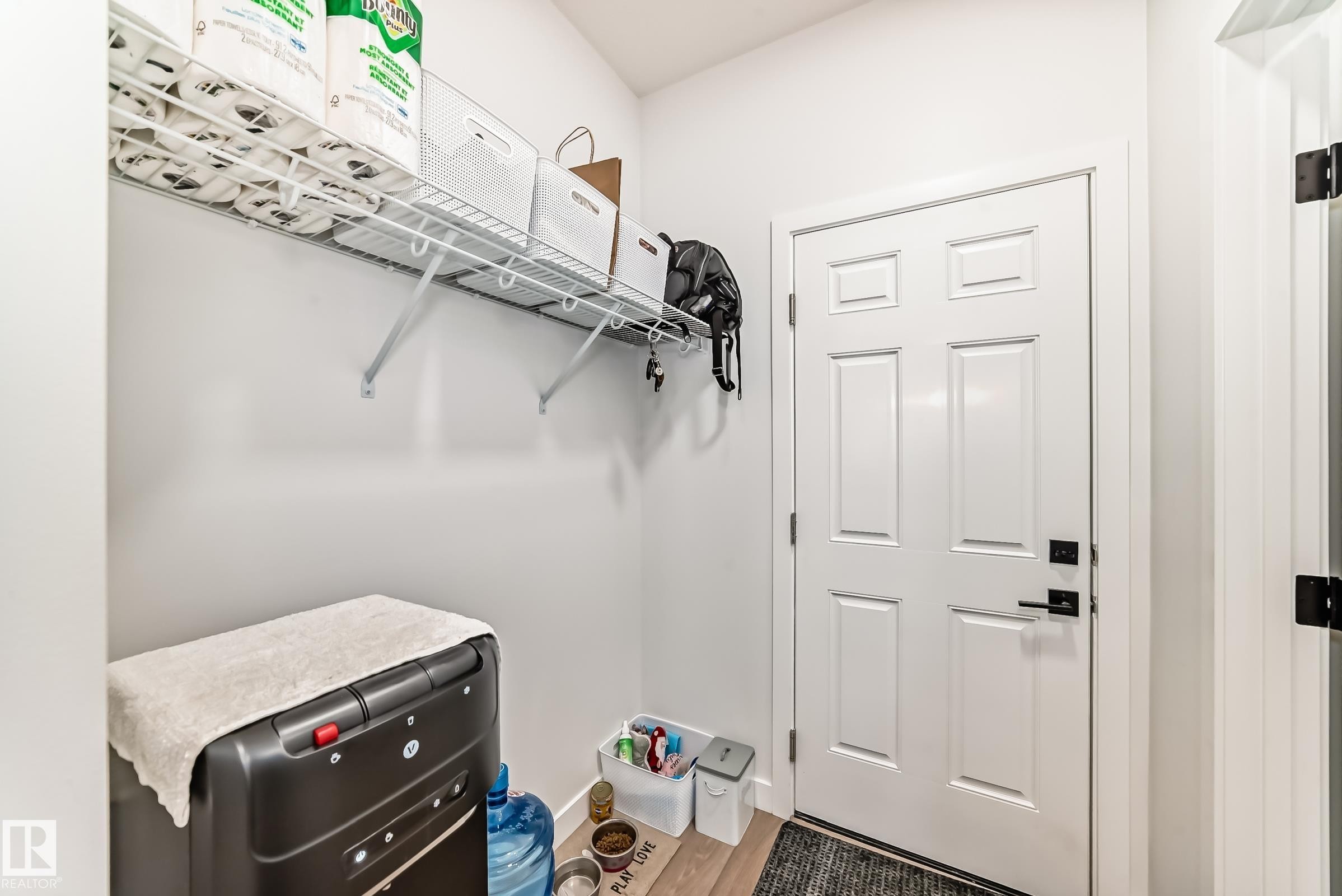 Walk in closet featuring wood finished floors - 3569 Erlanger Link, Edmonton, AB - Indoor With Storage