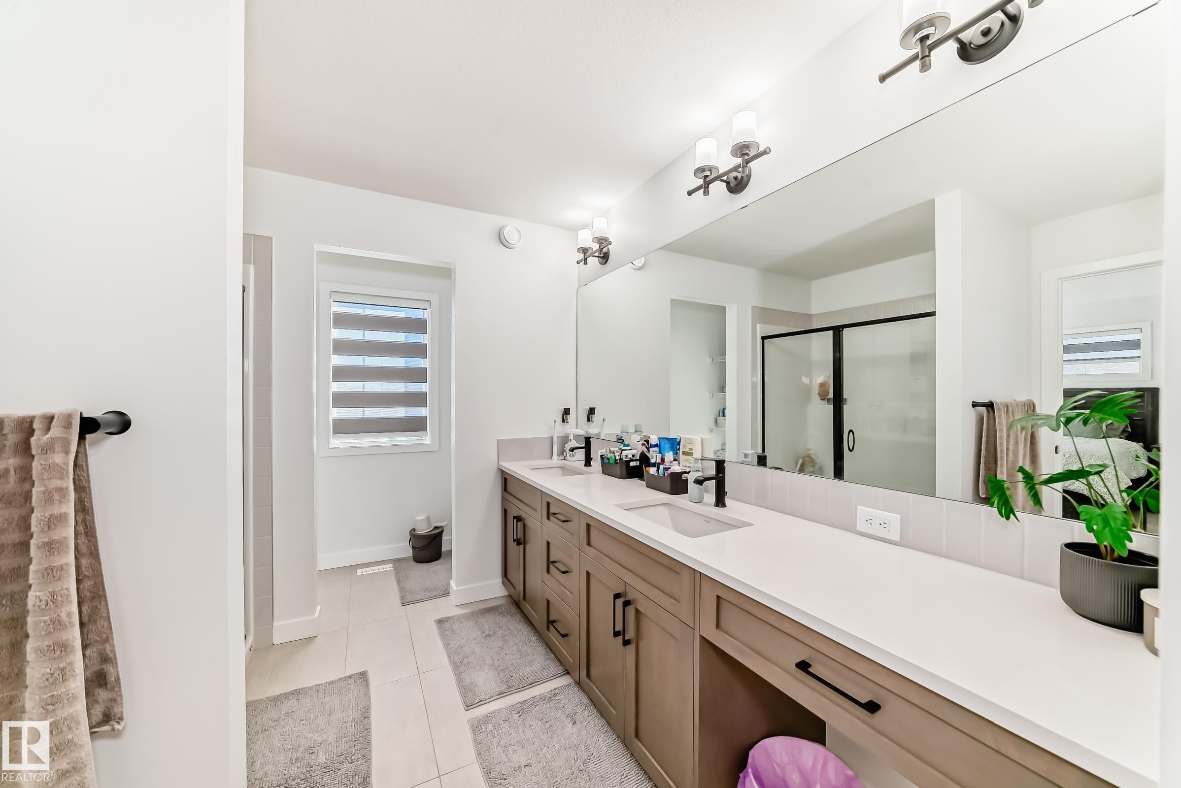 Full bathroom with double vanity, a shower stall, and light tile patterned floors - 3569 Erlanger Link, Edmonton, AB - Indoor Photo Showing Bathroom