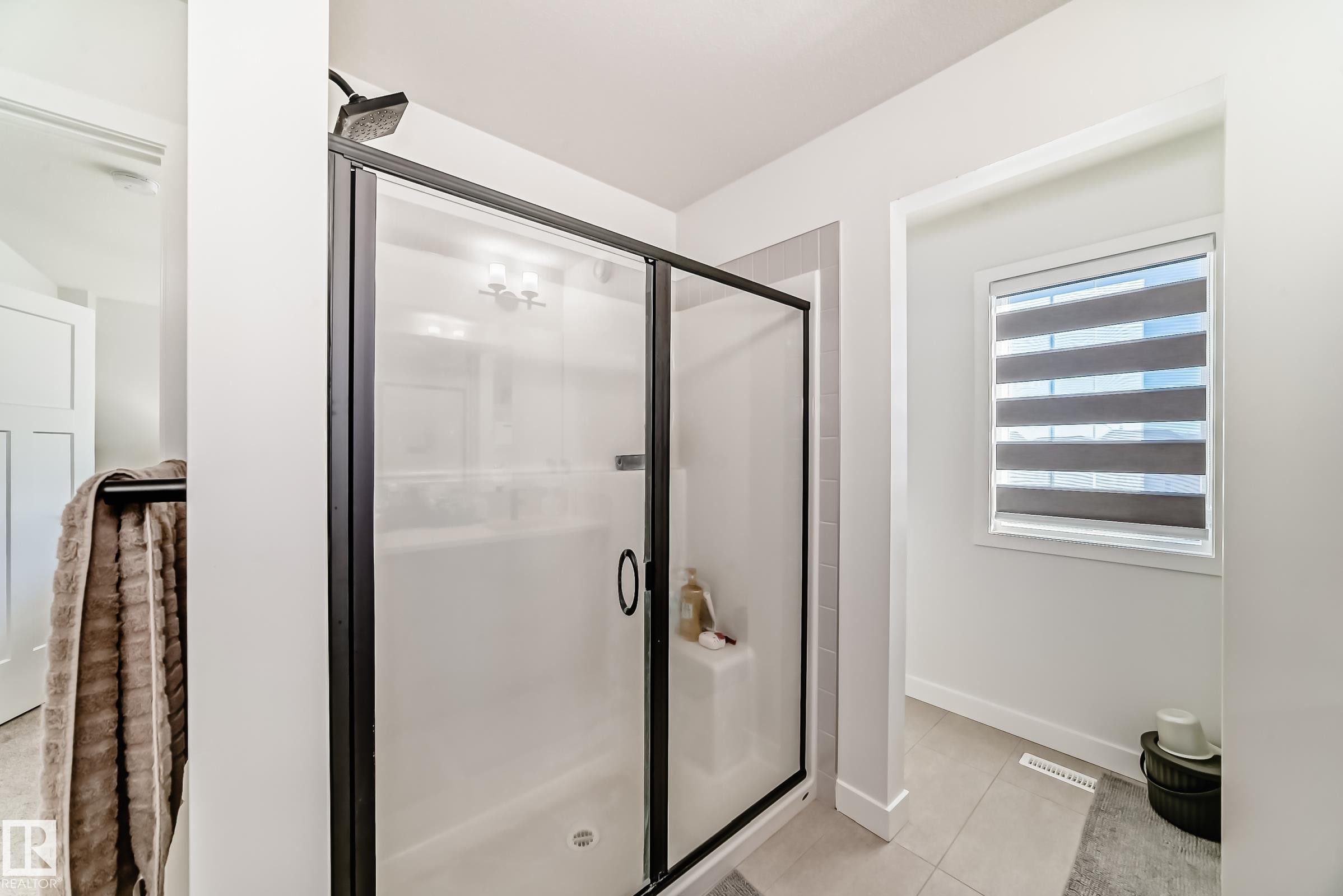 Bathroom with a shower stall and light tile patterned floors - 3569 Erlanger Link, Edmonton, AB - Indoor Photo Showing Bathroom