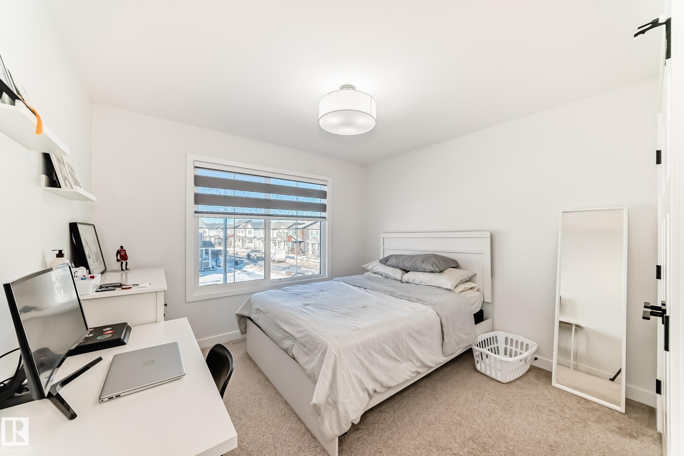 Bedroom with an office area and light colored carpet - 3569 Erlanger Link, Edmonton, AB - Indoor Photo Showing Bedroom