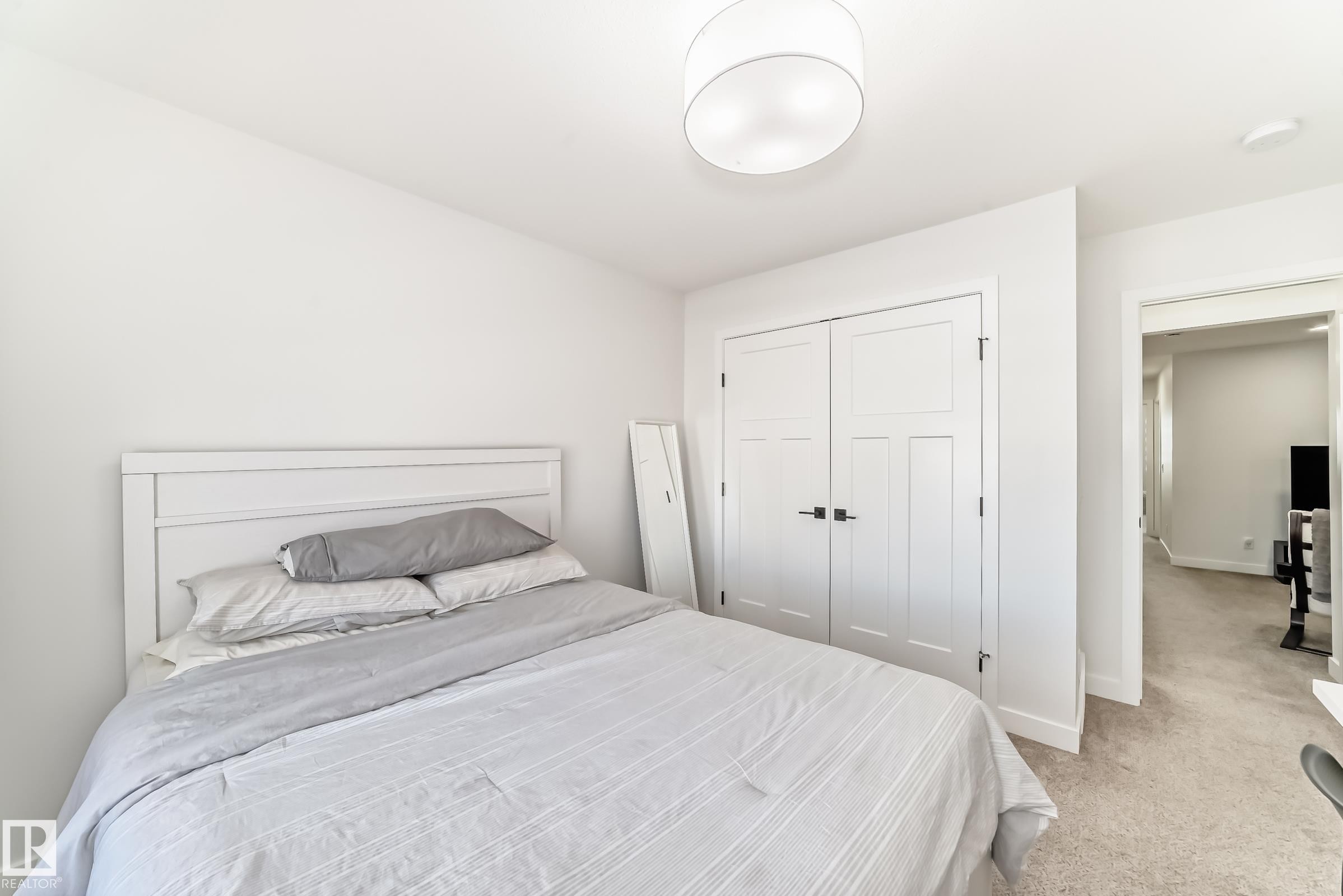 Carpeted bedroom with a closet and baseboards - 3569 Erlanger Link, Edmonton, AB - Indoor Photo Showing Bedroom