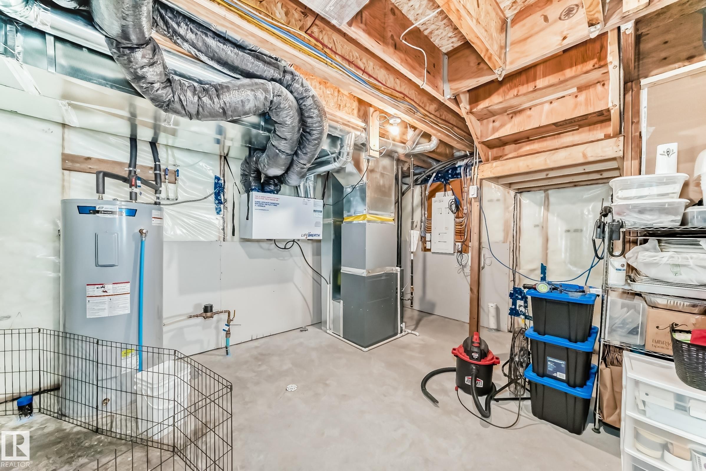 Unfinished basement featuring electric water heater - 3569 Erlanger Link, Edmonton, AB - Indoor Photo Showing Basement