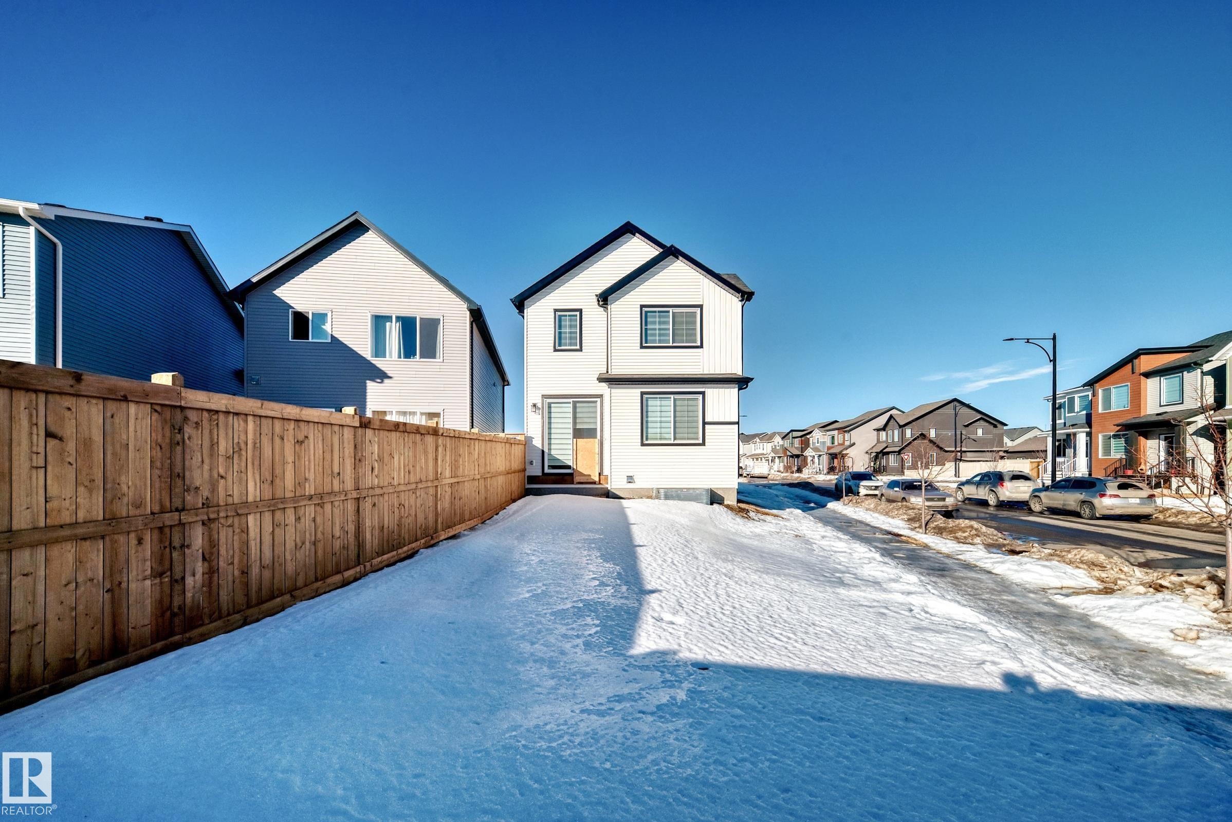 Snow covered rear of property featuring a residential view - 3569 Erlanger Link, Edmonton, AB - Outdoor