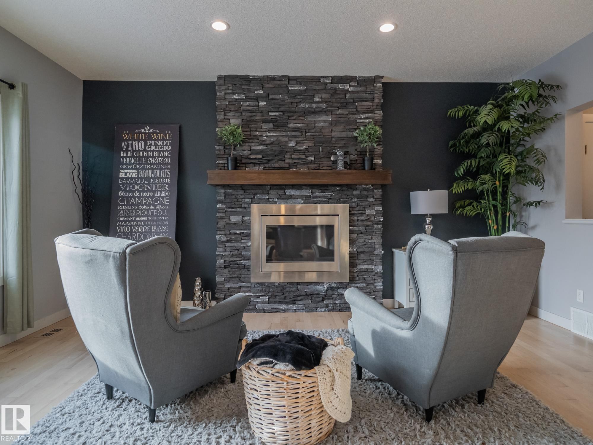4211 Charles Close, Edmonton, AB - Indoor Photo Showing Living Room With Fireplace