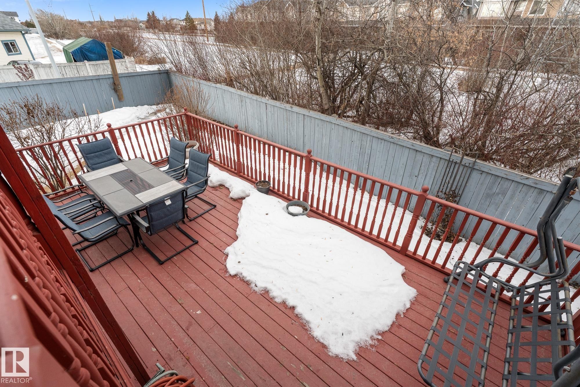 Snow covered deck featuring outdoor dining area - 13148 151 Avenue, Edmonton, AB - Outdoor With Deck Patio Veranda With Exterior