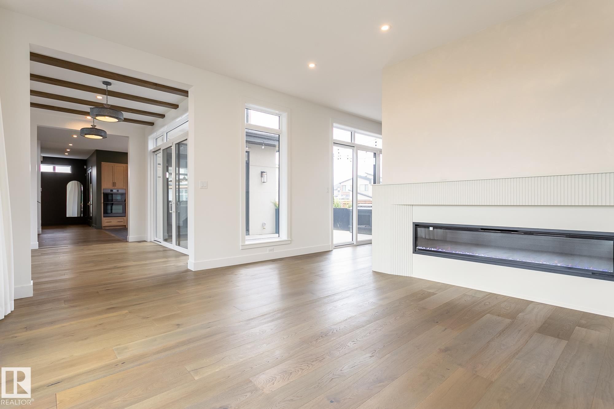 152 Hays Ridge Boulevard Sw, Edmonton, AB - Indoor Photo Showing Living Room With Fireplace