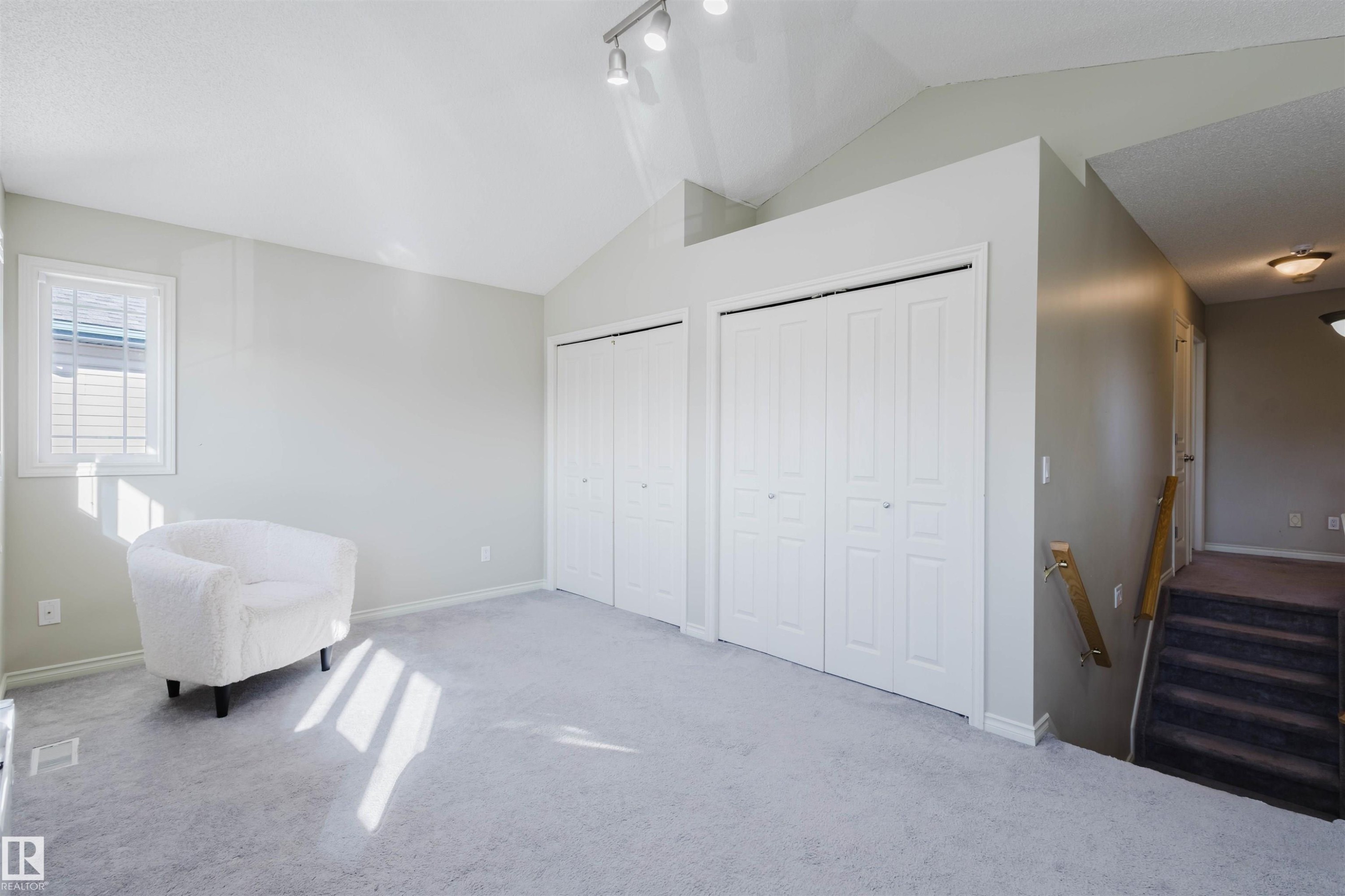 Sitting room with carpet and rail lighting - 3534 Mclean Crescent, Edmonton, AB - Indoor