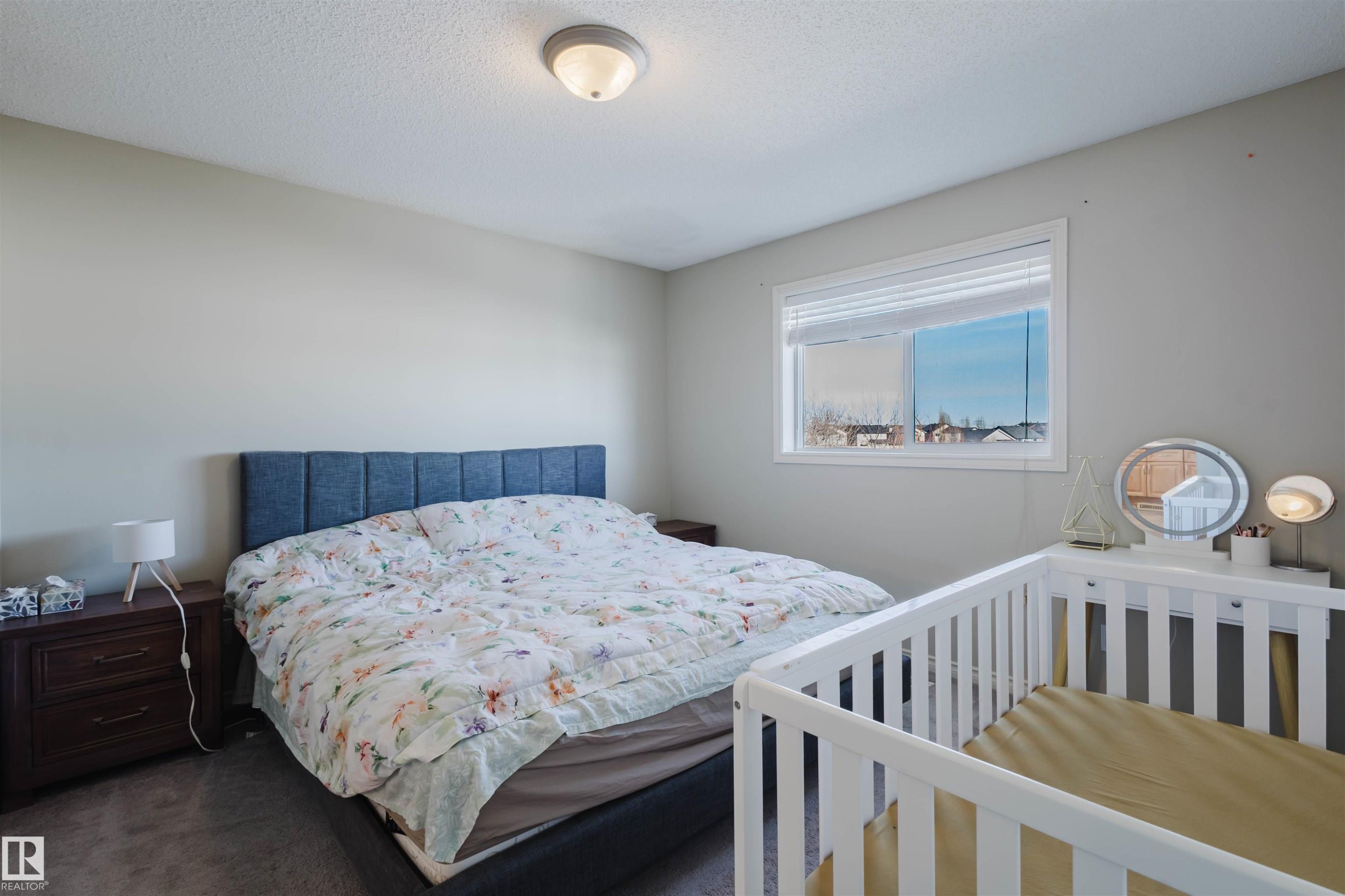 Carpeted bedroom featuring a textured ceiling - 3534 Mclean Crescent, Edmonton, AB - Indoor Photo Showing Bedroom