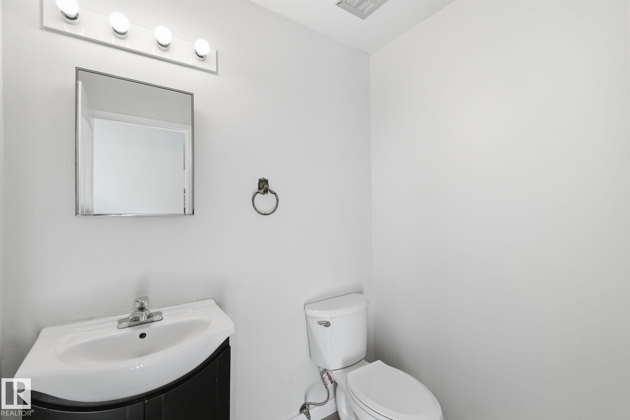 Bathroom featuring vanity and toilet - 180 Londonderry Square, Edmonton, AB - Indoor Photo Showing Bathroom