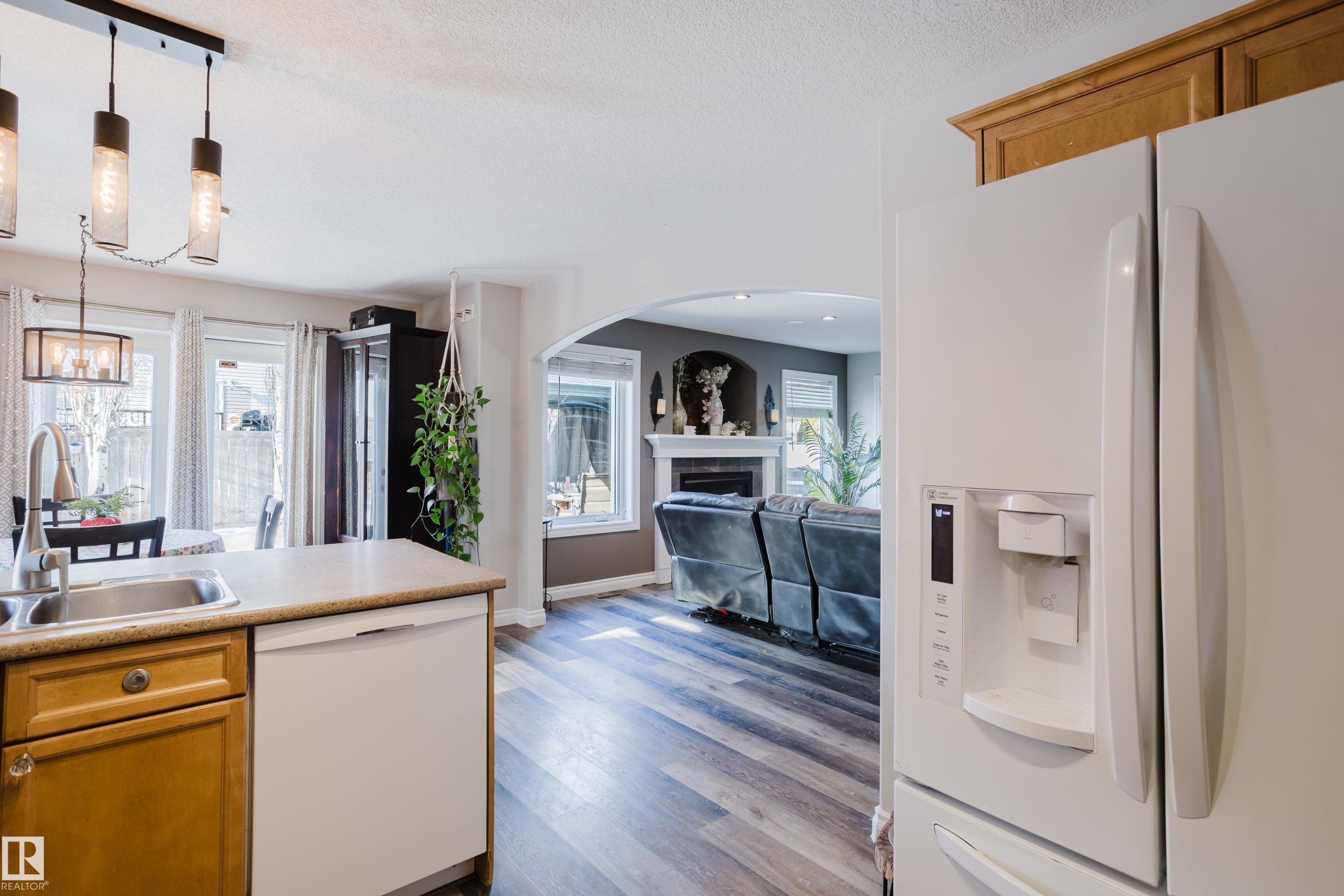 66 Grayridge Crescent, Stony Plain, AB - Indoor Photo Showing Kitchen With Fireplace