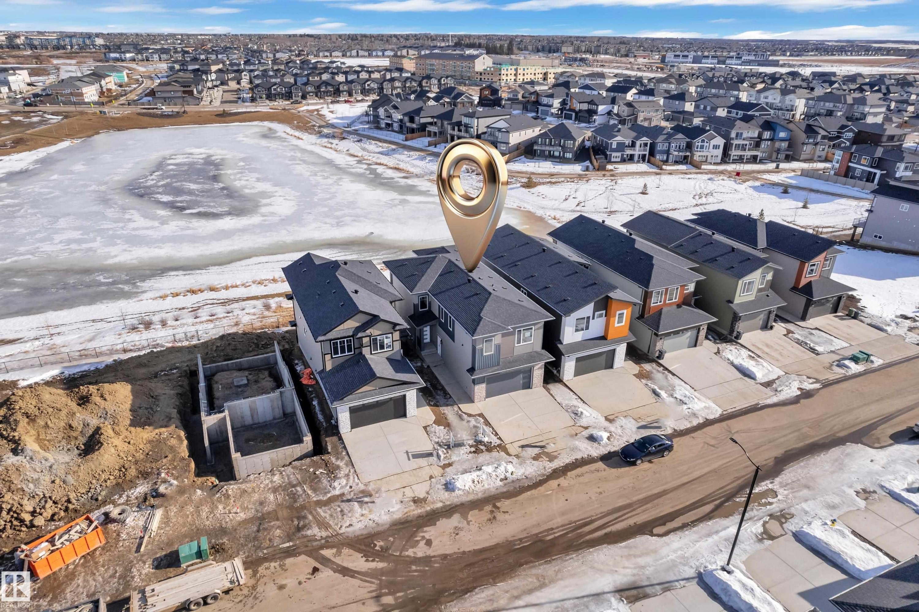 Snowy aerial view featuring a residential view - 228 Linden Loop, Leduc, AB - Outdoor With View